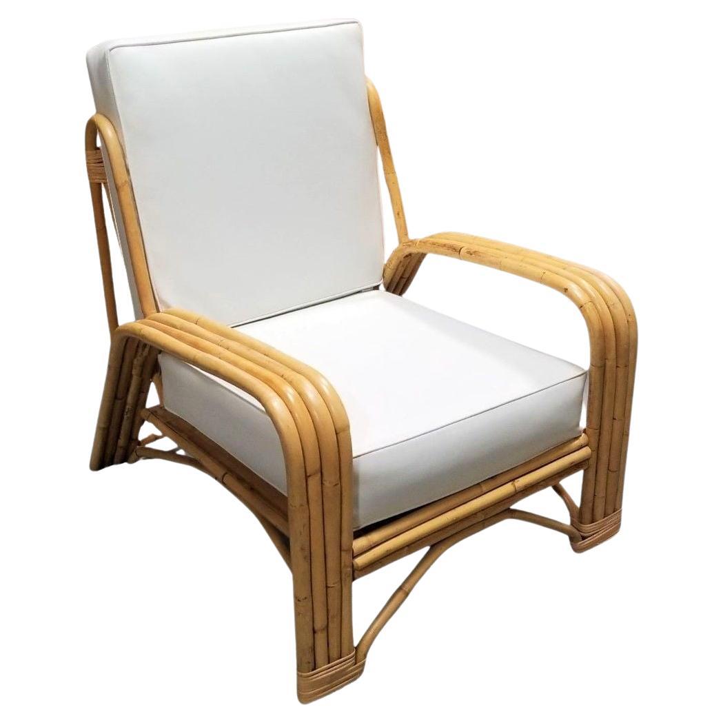 Restored 4-Strand Staple Arm Rattan Lounge Chair by Paul Laszlo For Sale
