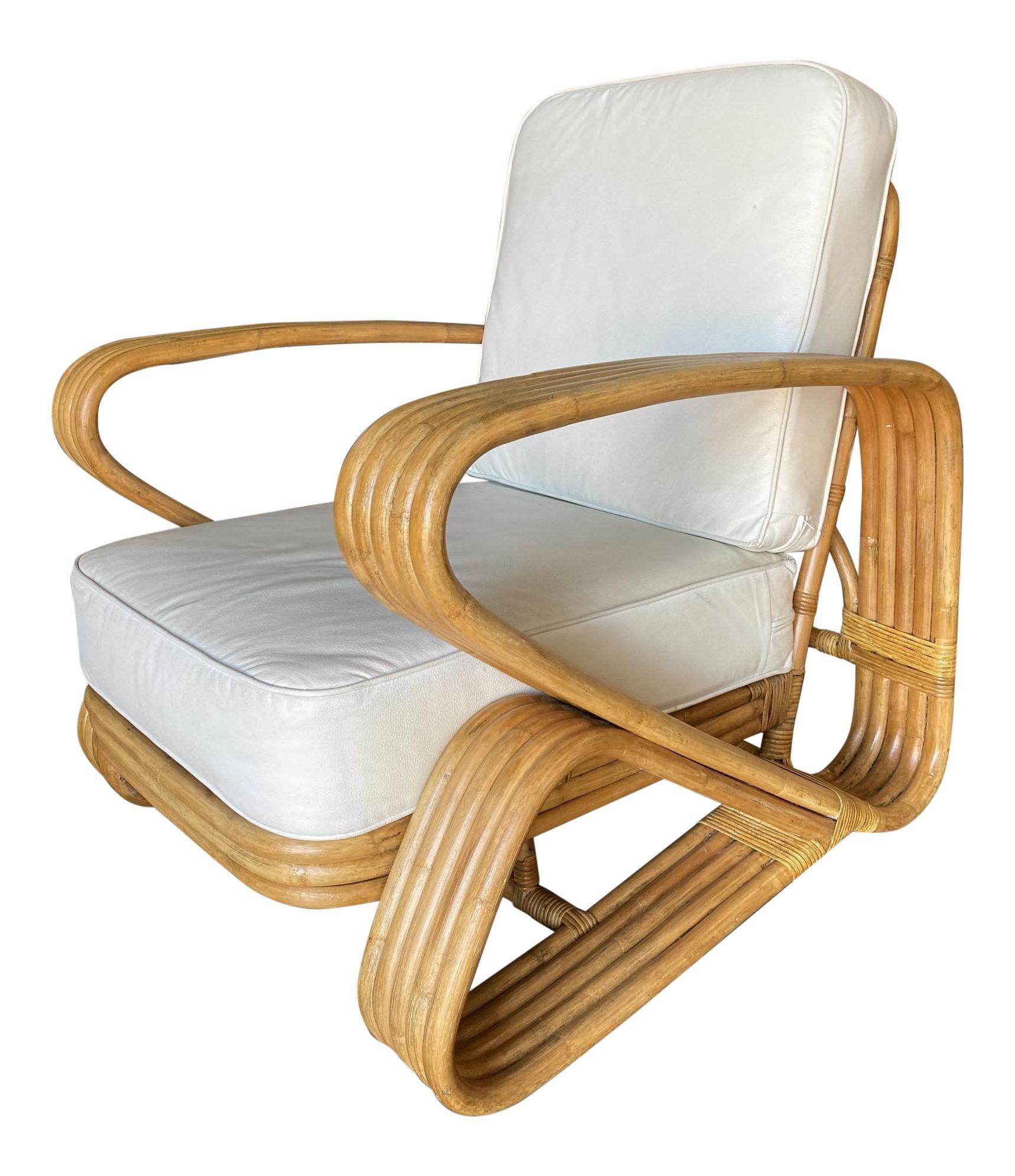 Rare Five-strand 'Double Triangle' lounge chair with a floating seat featuring large oversized arms.

1950, United States

We only purchase and sell only the best and finest rattan furniture made by the best and most well-known American
