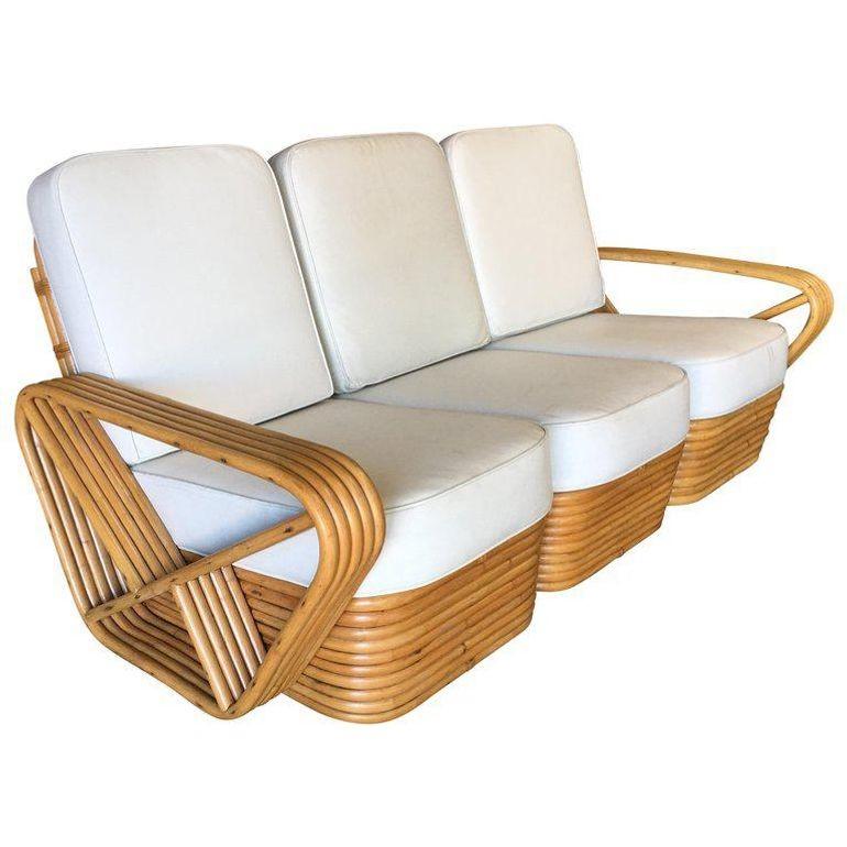 Five-strand square pretzel style living room set featuring a three-seat sectional sofa and lounge chair. This sofa and chair feature the famous five-strand square pretzel side arms and a stacked rattan base originally designed by Paul Frankl. Great