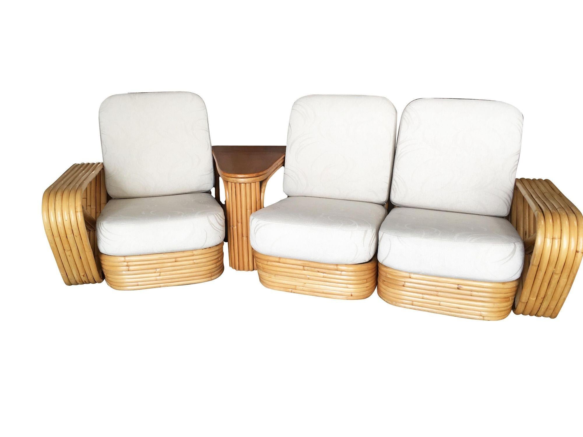 This beautifully restored Paul Frankl-inspired rattan blends vintage charm with modern comfort. Rare Square Pretzel rattan 3 seater sectional sofa with Paul Frankl inspired design featuring 6 strand rattan arms and Stacked pole base. Comes with