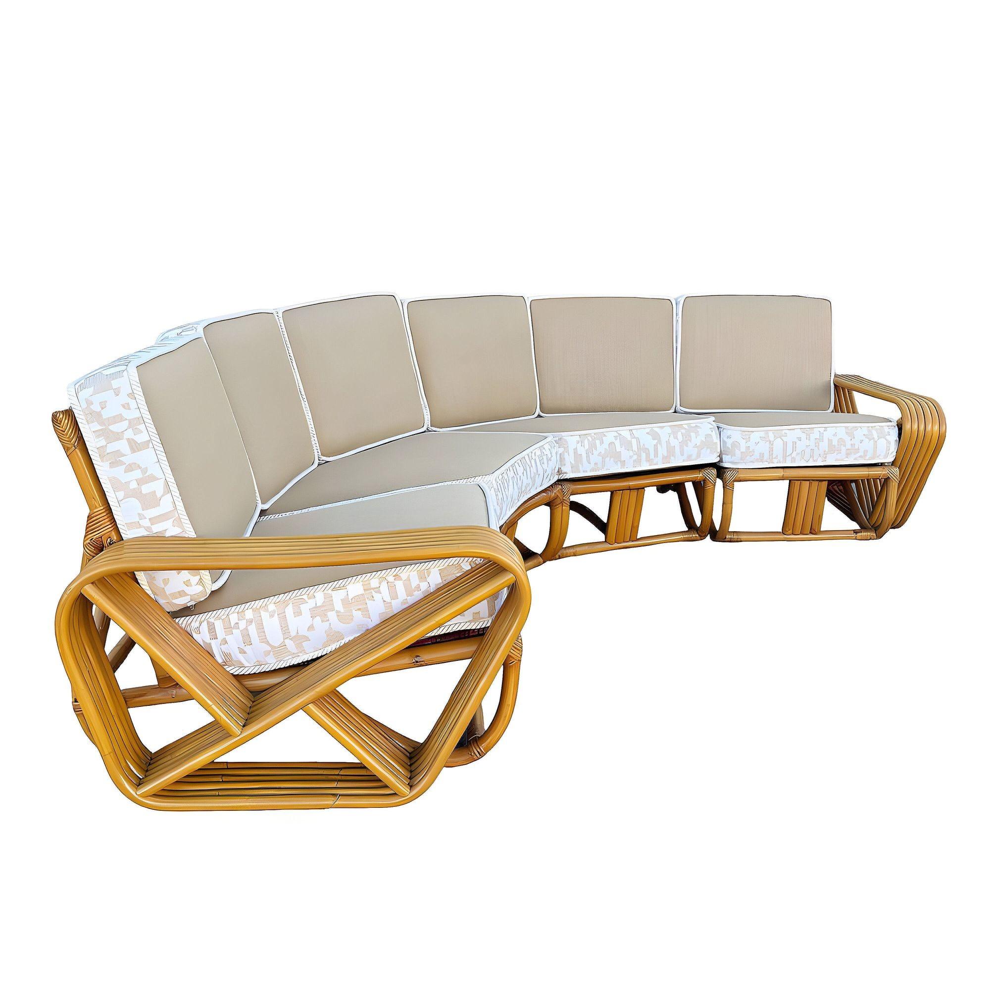 This beautifully restored Paul Frankl-inspired Mid-Century six-strand square pretzel rattan Corner Sectional sofa with six seats. This sofa features a round 3-strand pattern rattan base with six-strand square pretzel arms and is divided into four