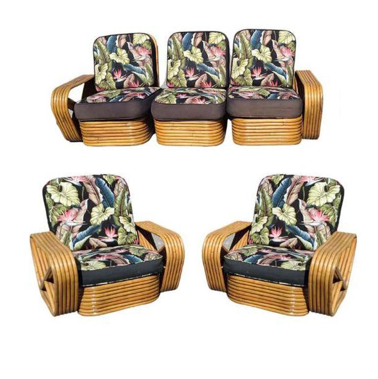 Art Deco Rattan living-room set including a matching 3-seat sectional sofa and lounge chair with matching stacked coffee table with two side tables. Both lounge chairs and sofas feature the famous six-strand square pretzel side arms and stacked