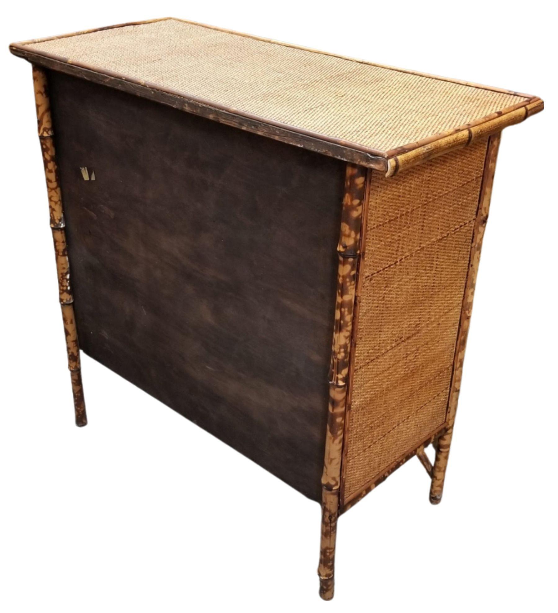 Turn-of-the-century Tiger Bamboo dresser of the Aesthetic Movement era with handwoven rice mat tops and sides and Tiger Bamboo also known as 