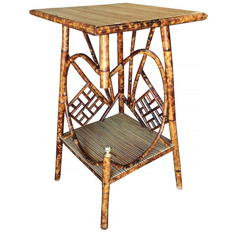 Asian inspired Art Deco tiger bamboo pedestal side table with rice mat top and secondary bottom shelf.


Restored to new for you.

All rattan, bamboo and wicker furniture has been painstakingly refurbished to the highest standards with the best
