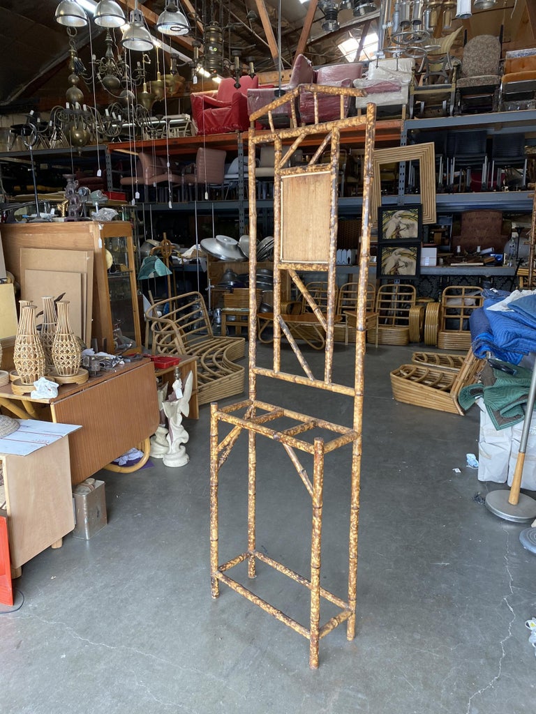 Antique tiger bamboo umbrella stand with a decorative square centerpiece. This stand features three slots for storing umbrellas and a vanity mirror.

Center Mirror will be added once the stand has been purchased.

Restored to new for you.

All
