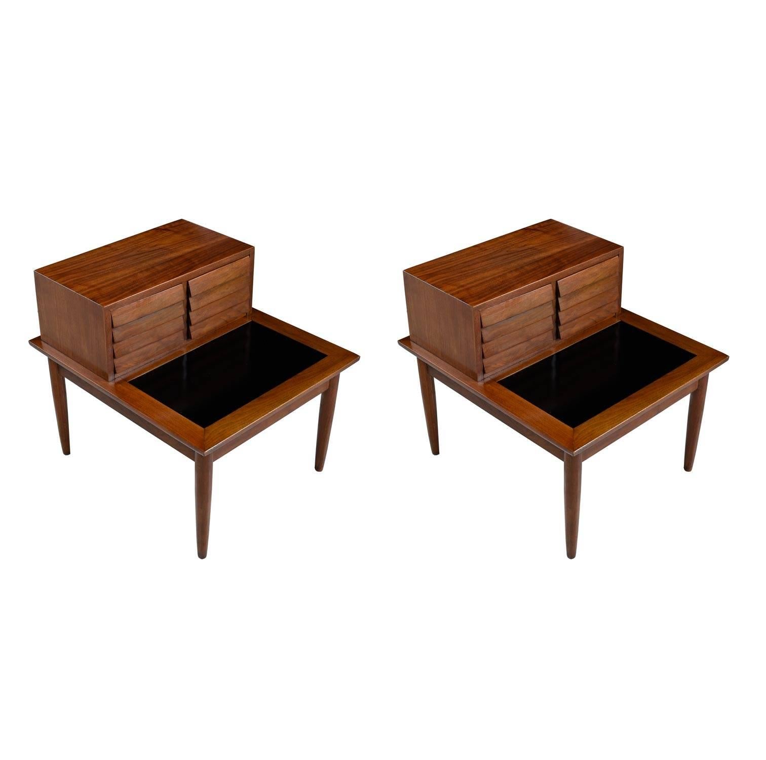 Pair of professionally refinished Dania lamp tables by American of Martinsville. One of the most celebrated lines of the Mid-Century Modern era. Designed by Merton Gershun, this set of Dania nightstands features Danish inspired Minimalist styling