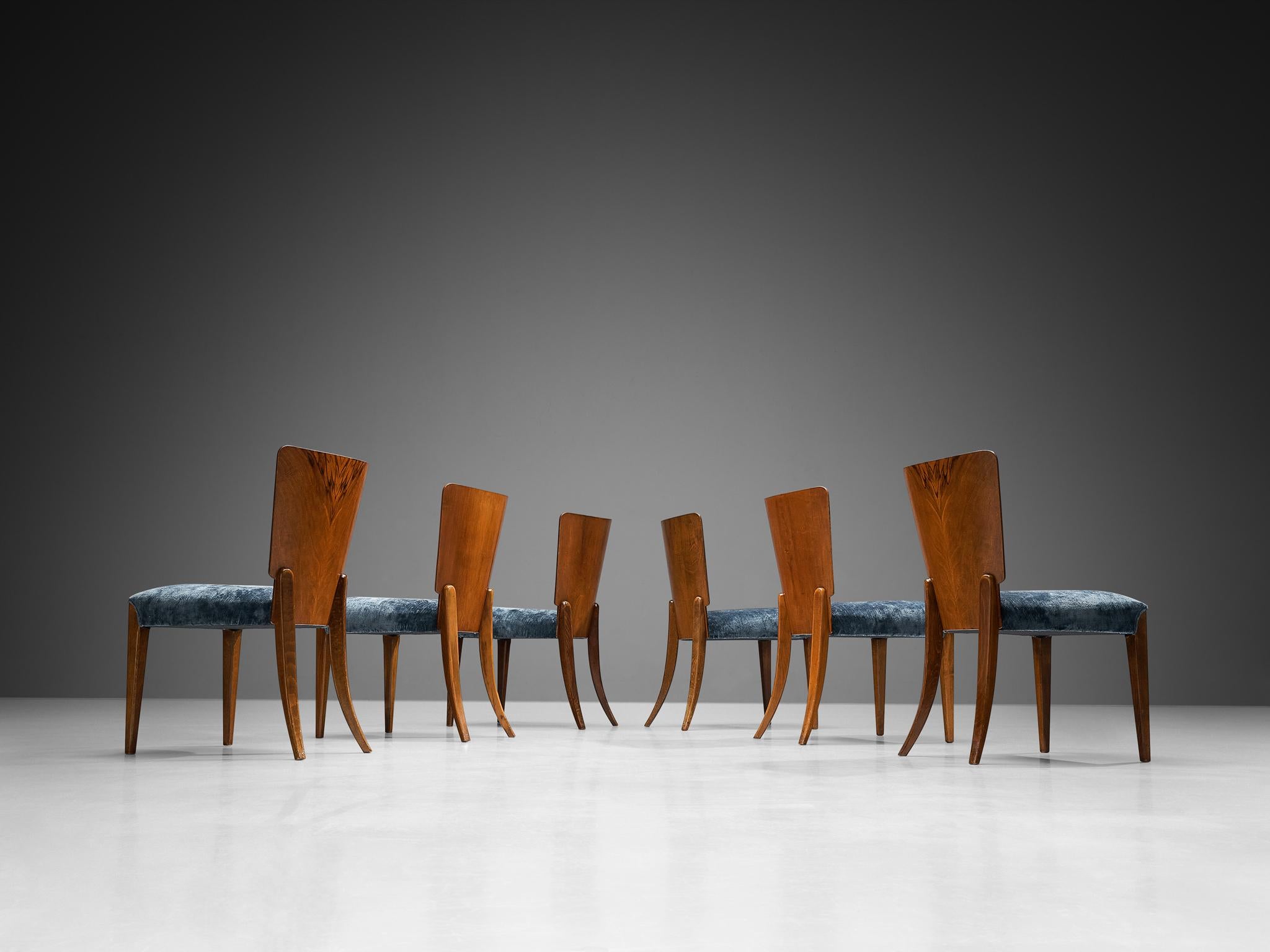 Set of six dining chairs, walnut, velvet, Czech Republic, 1930s

These sophisticated and elegant Art Deco dining chairs were designed in the 1930s. The backrest and legs of the chairs are executed in an enthralling walnut wood. The restored set of