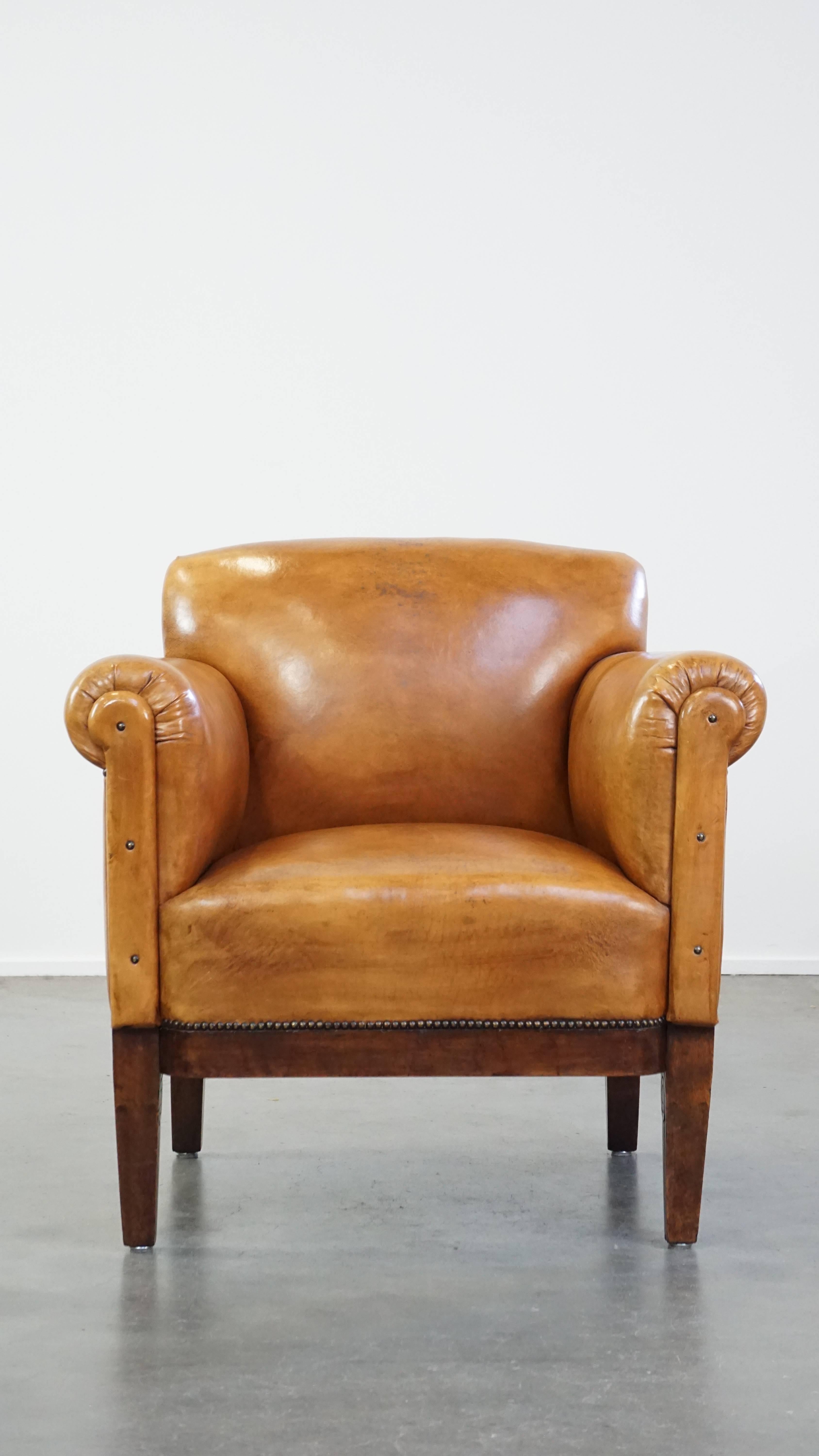 This correct, restored, and reupholstered antique art deco sheepskin armchair is easily placed in virtually any interior. It is in good condition, has a beautiful finish, and, in our opinion, should not be missing from any home. The armchair