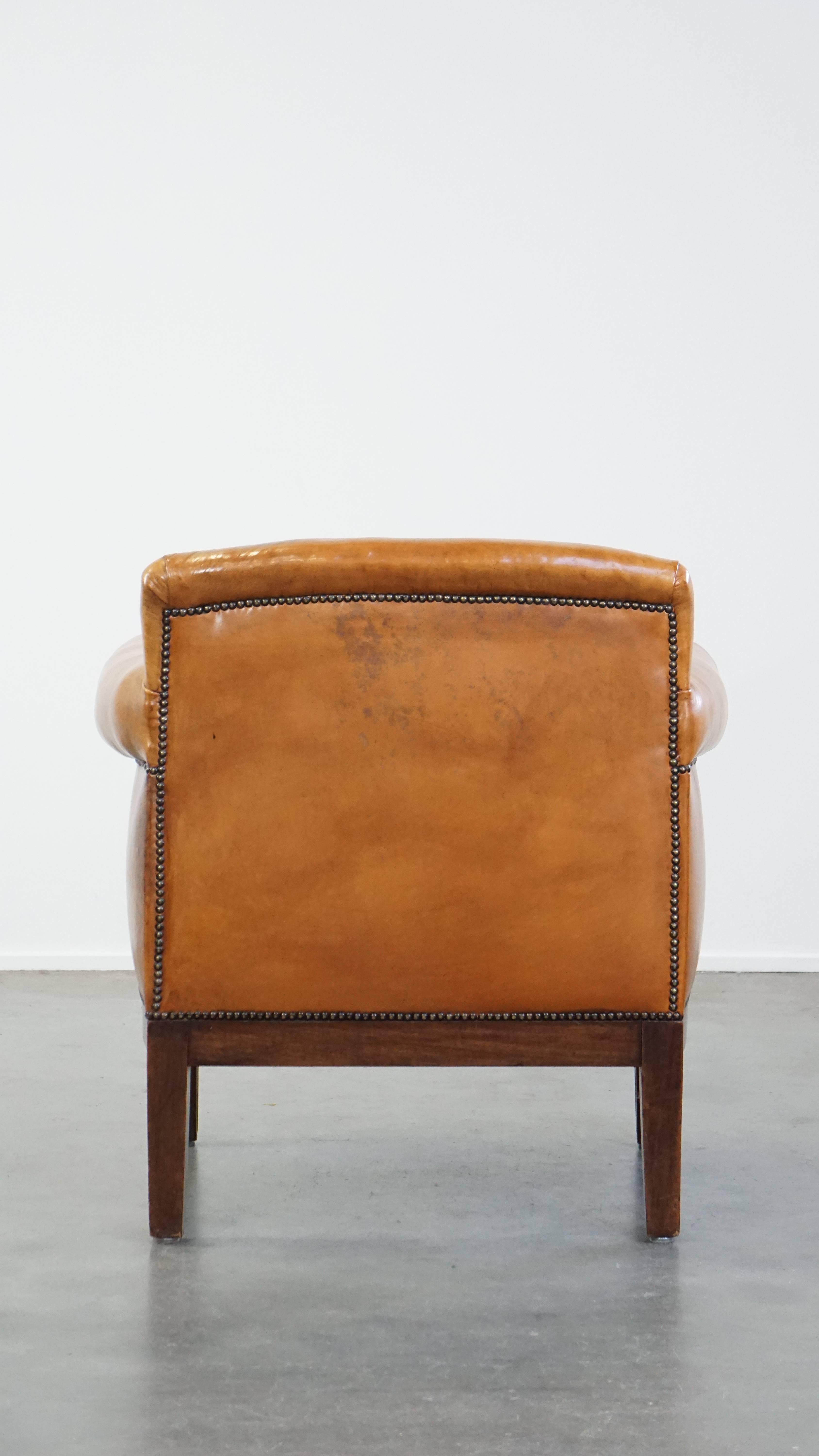 Restored antique Art Deco sheepskin armchair with correct seating comfort In Good Condition For Sale In Harderwijk, NL
