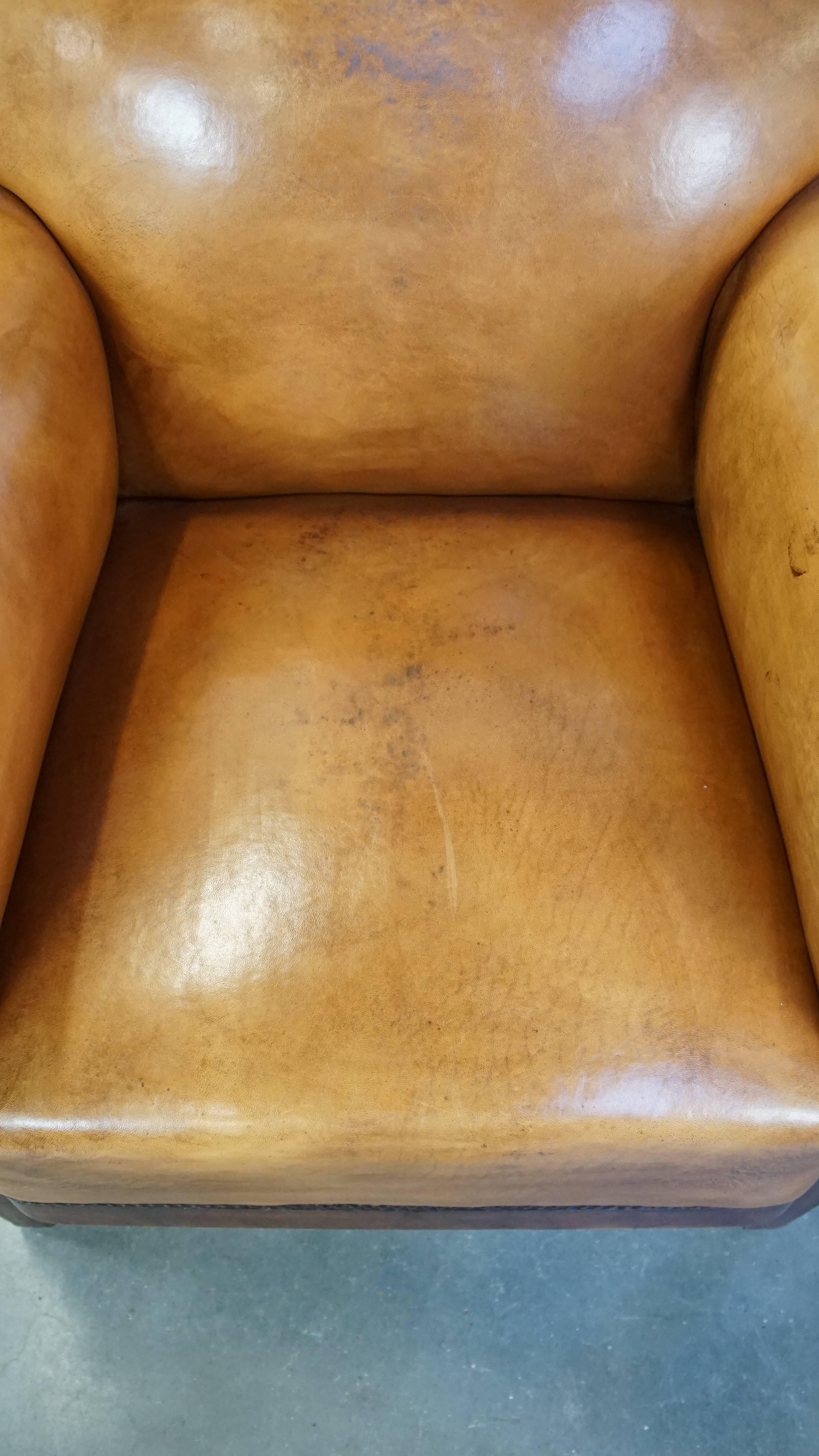 Sheepskin Restored antique Art Deco sheepskin armchair with correct seating comfort For Sale