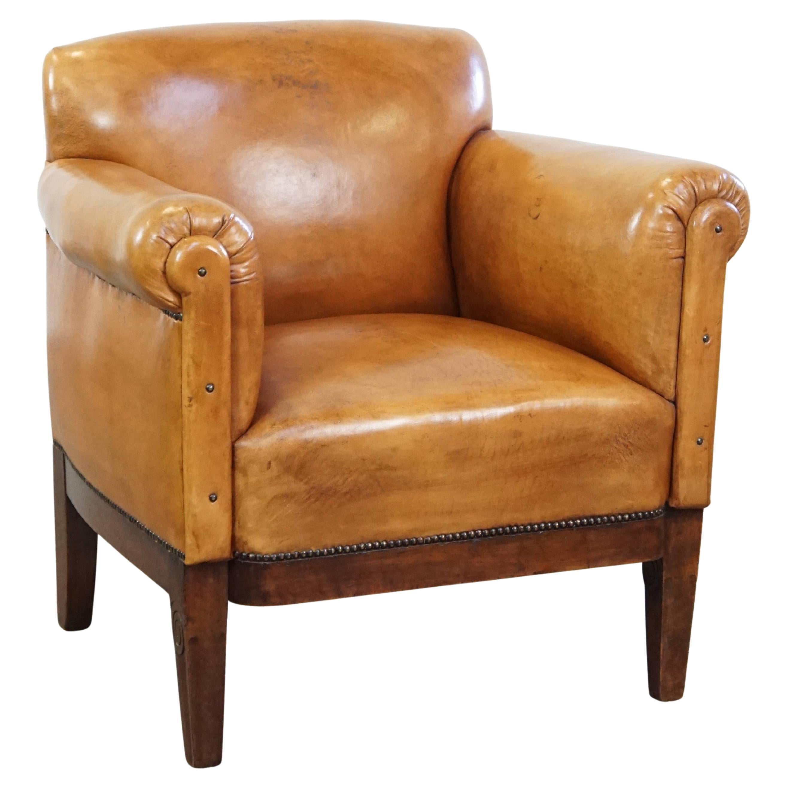 Restored antique Art Deco sheepskin armchair with correct seating comfort For Sale