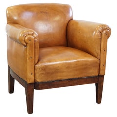 Restored antique Art Deco sheepskin armchair with correct seating comfort