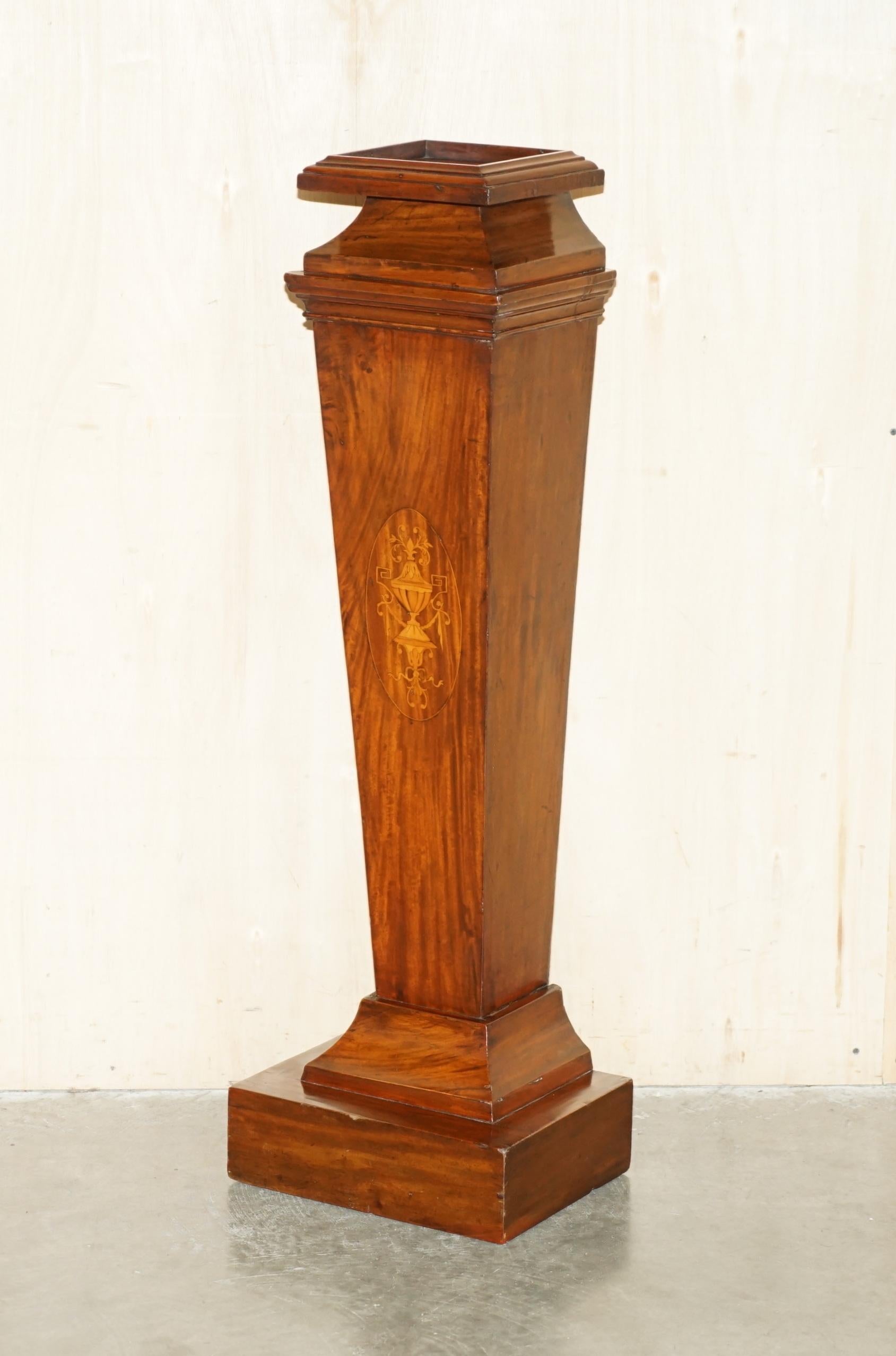 Royal House Antiques

Royal House Antiques is delighted to offer for sale this lovely hand made in England, flamed Mahogany with Walnut Sheraton Revival inlay pedestal stand for displaying plants, busts, taxidermy and trinkets 

Please note the