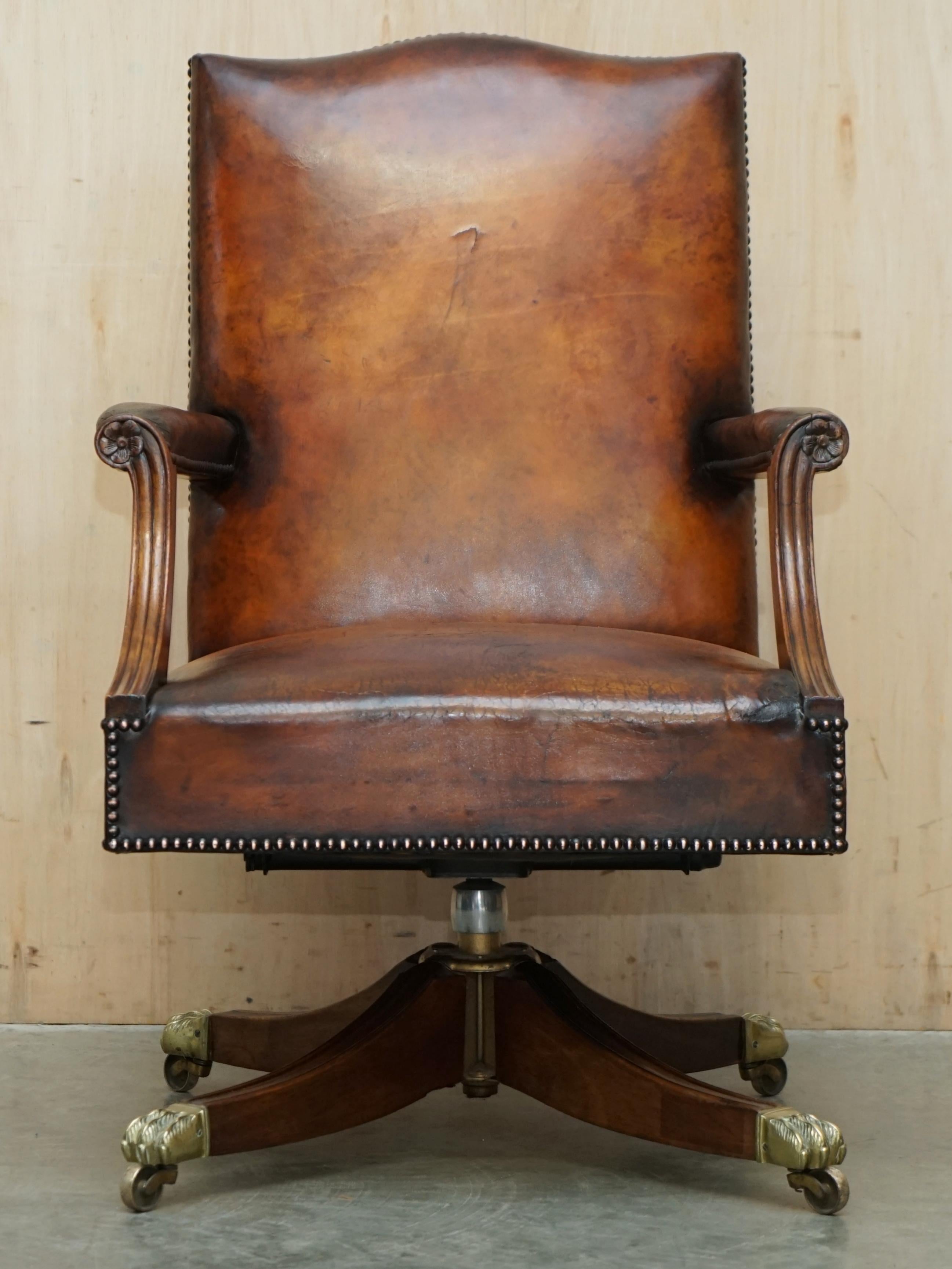 Royal House Antiques

Royal House Antiques is delighted to offer for sale this stunning original English circa 1940's full restored hand dyed brown leather captains office swivel armchair with solid brass, Lions Hairy Paw castors 

Please note the