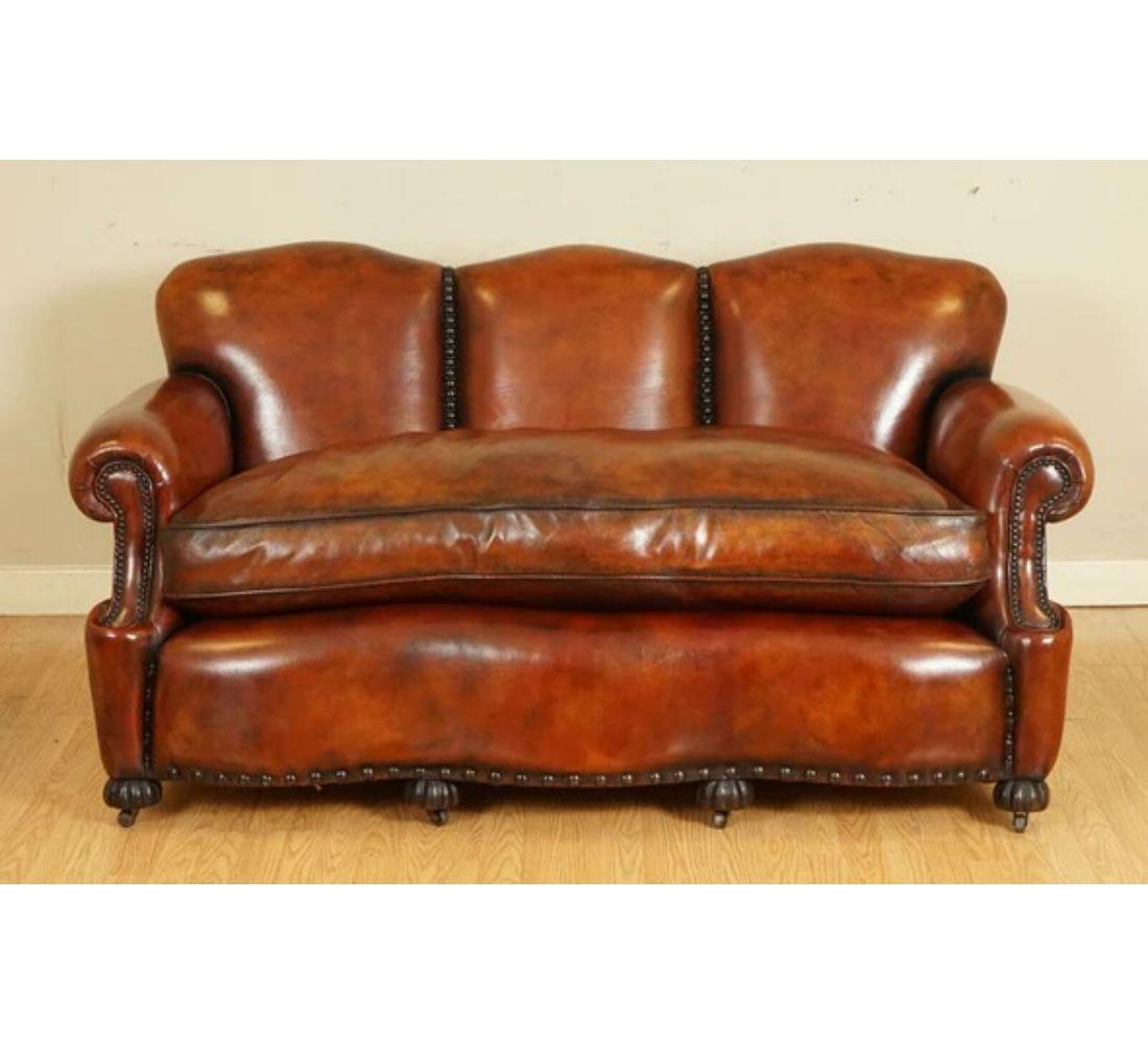 We are delighted to offer for sale this stunning hand dyed in whisky brown leather sofa. 

This sofa is truly one of a kind, and it has been owned by a family who had passed it down for generations. The last owner had the whole leather