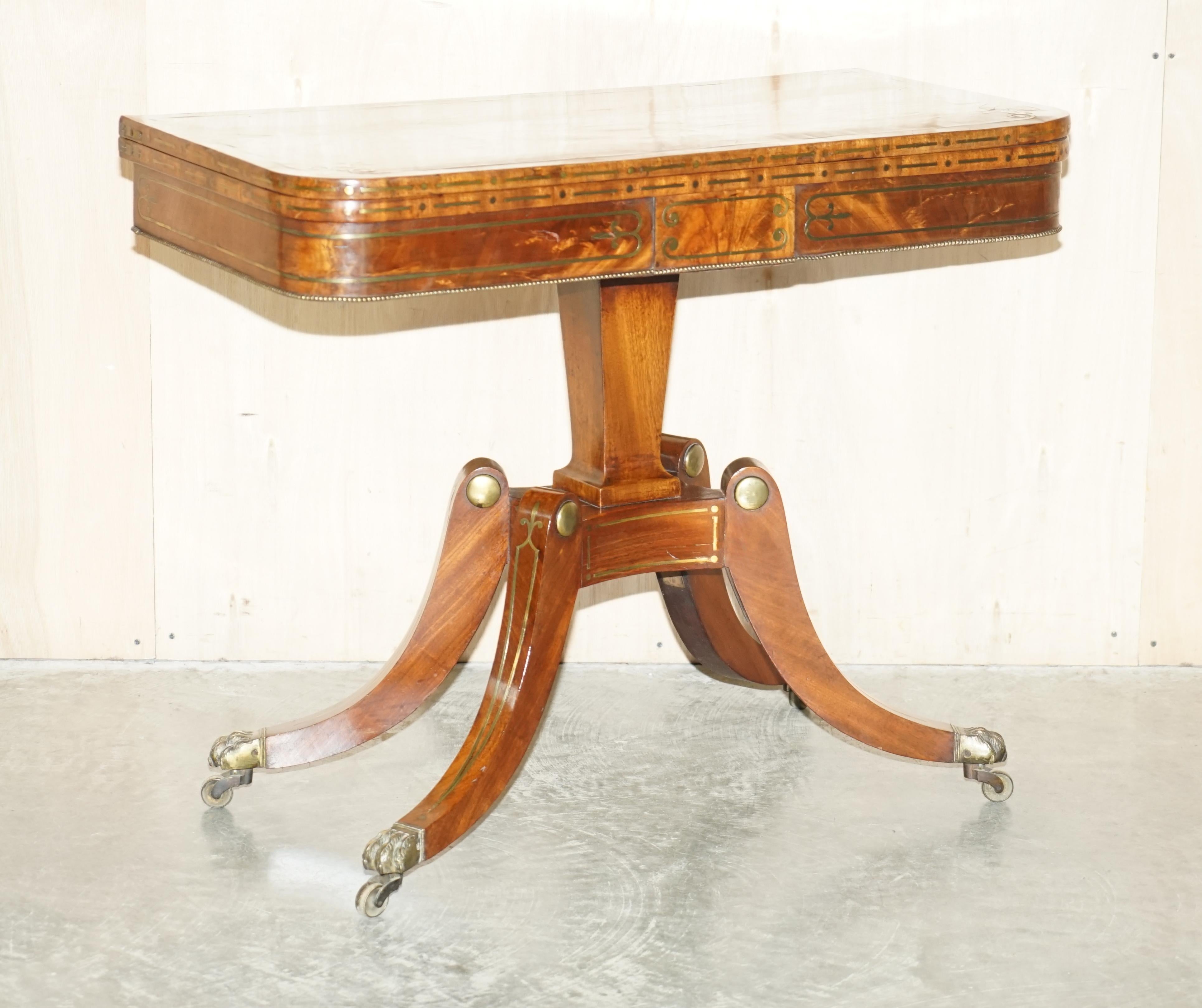 Royal House Antiques

Royal House Antiques is delighted to offer for sale this exquisite, fully restored, hand made in England Regency circa 1815 Mahogany with brass inlay occasional table with baize lined card top inside.

A very rare example,