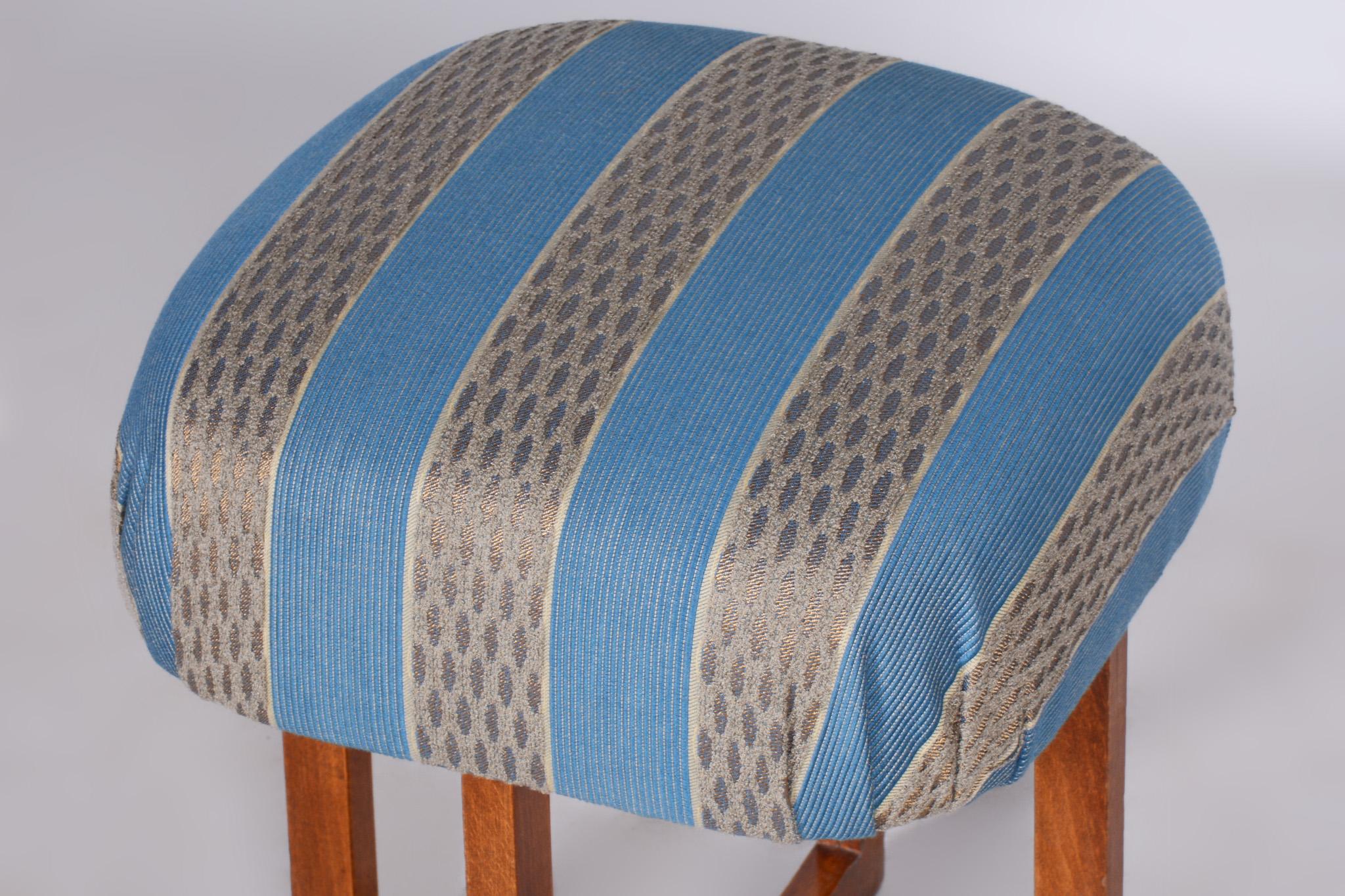 Restored Art Deco Beech Stool with New Upholstery.

Period: 1930 - 1939
Source: Czechia (Czechoslovakia)
Material: Beech, Fabric, Upholstery
New professional upholstery.
Revived polish.

According to the original process, our professional