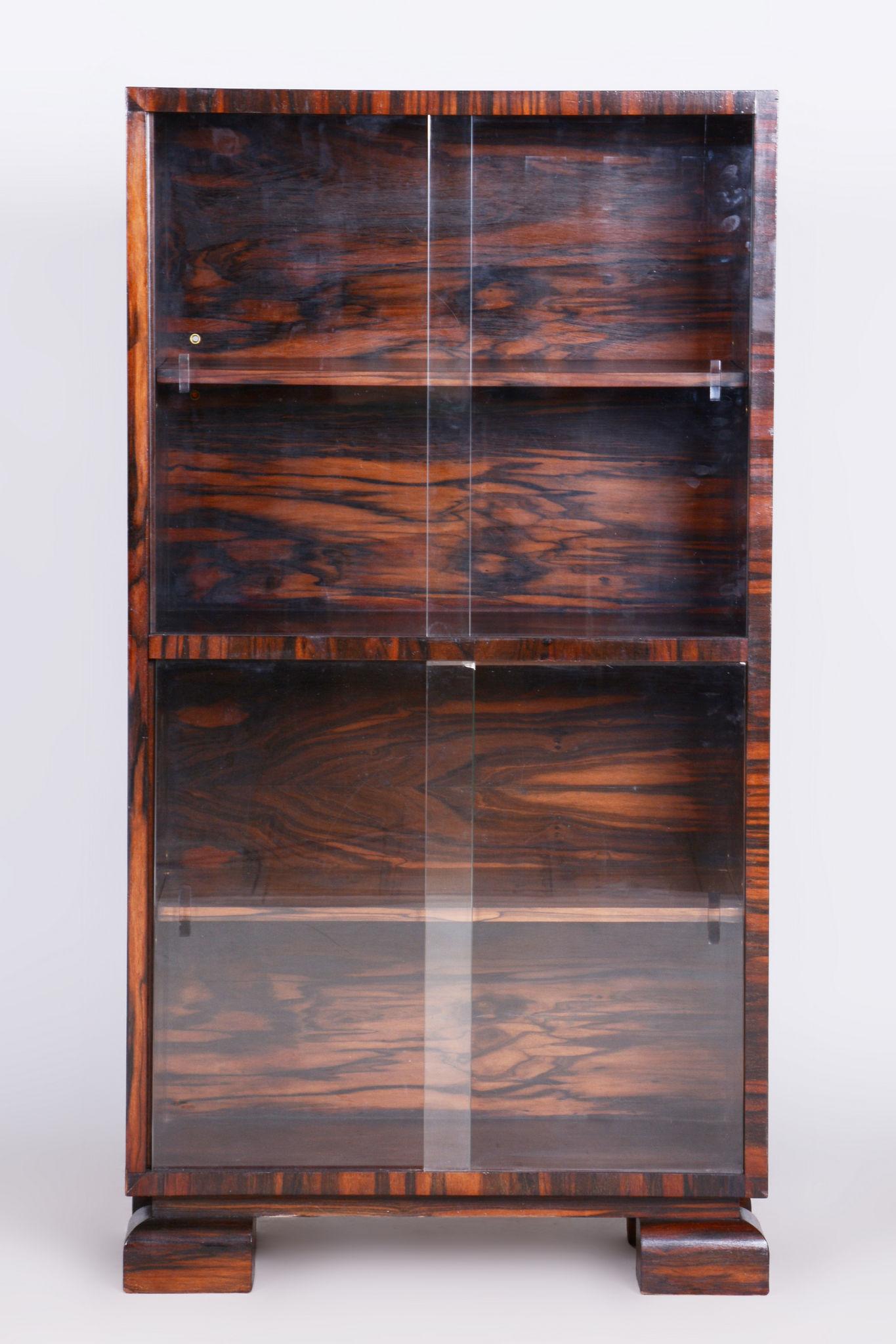 Restored Art Deco bookcase

Source: Czechia
Period: 1930-1939
Material: Macassar, Glass
Architect: Oldřich Liška

Restored to a luxurious finish. 

It has been re-polished with polyutherane piano lacquer by our professional refurbishing team in