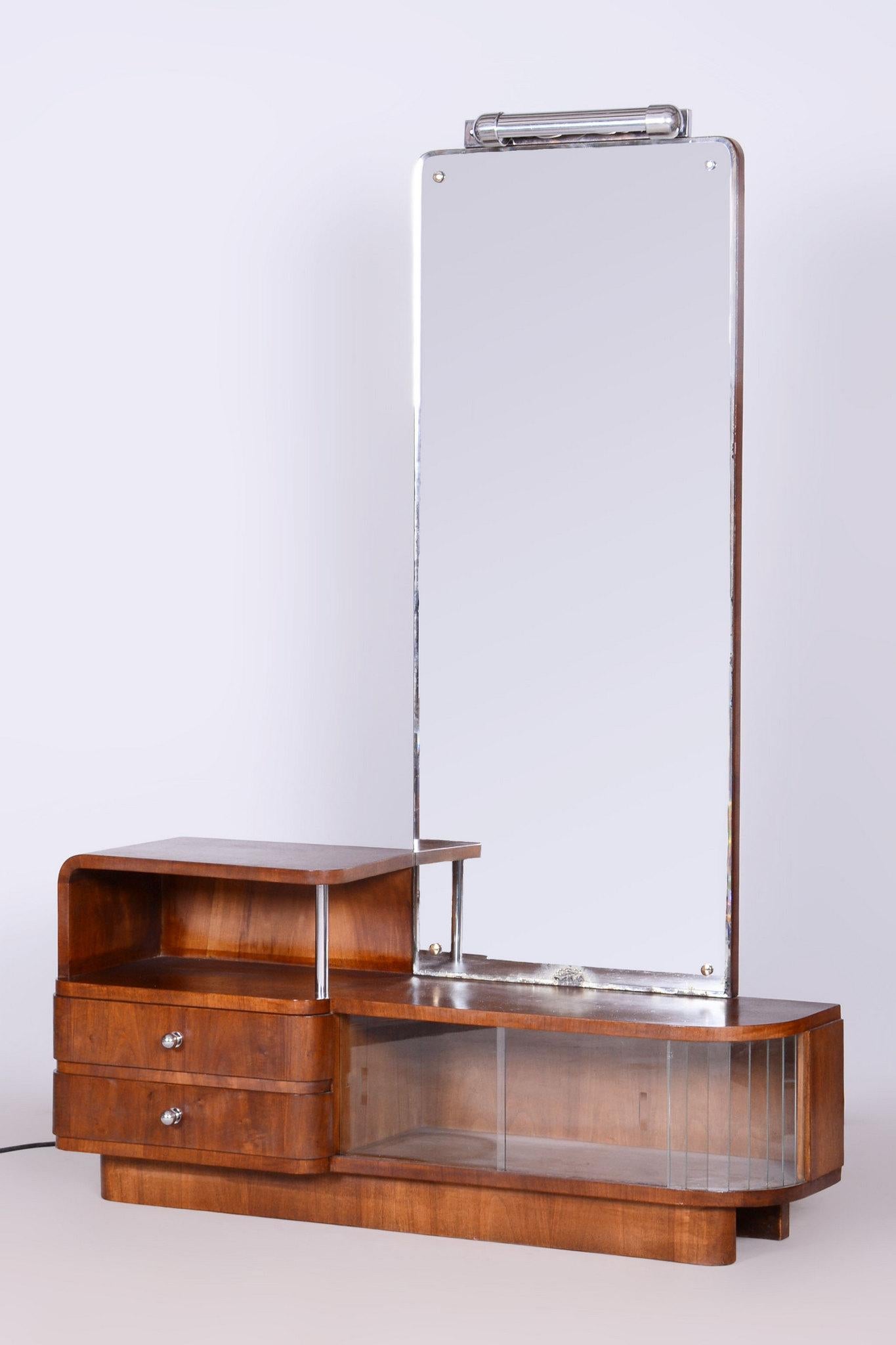 Designed by renowned Czech designer Robert Slezak. 

This dressing table with elements of Art Deco and Bauhaus originates from the first half of the 20th century in Czechoslovakia. It was produced by Slezákovy závody and is made from sprucewood