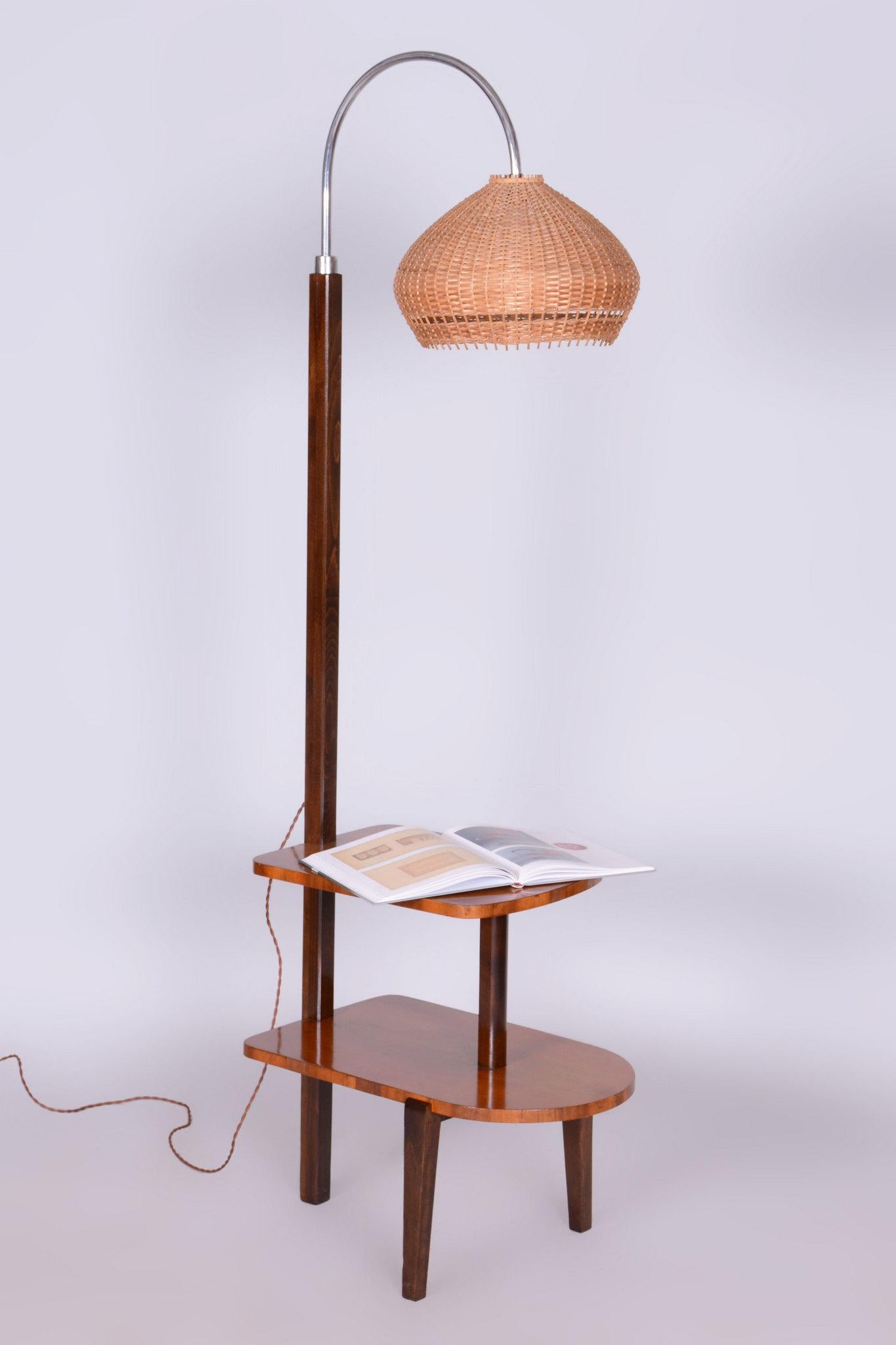 Designed by Jindrich Halabala, a renowned designer credited with ushering in the mass market production of furniture in his native Czechoslovakia.

Made by UP Zavody, a well-known Czechoslovakian furniture manufacturer and dealer based in Brno. 

It