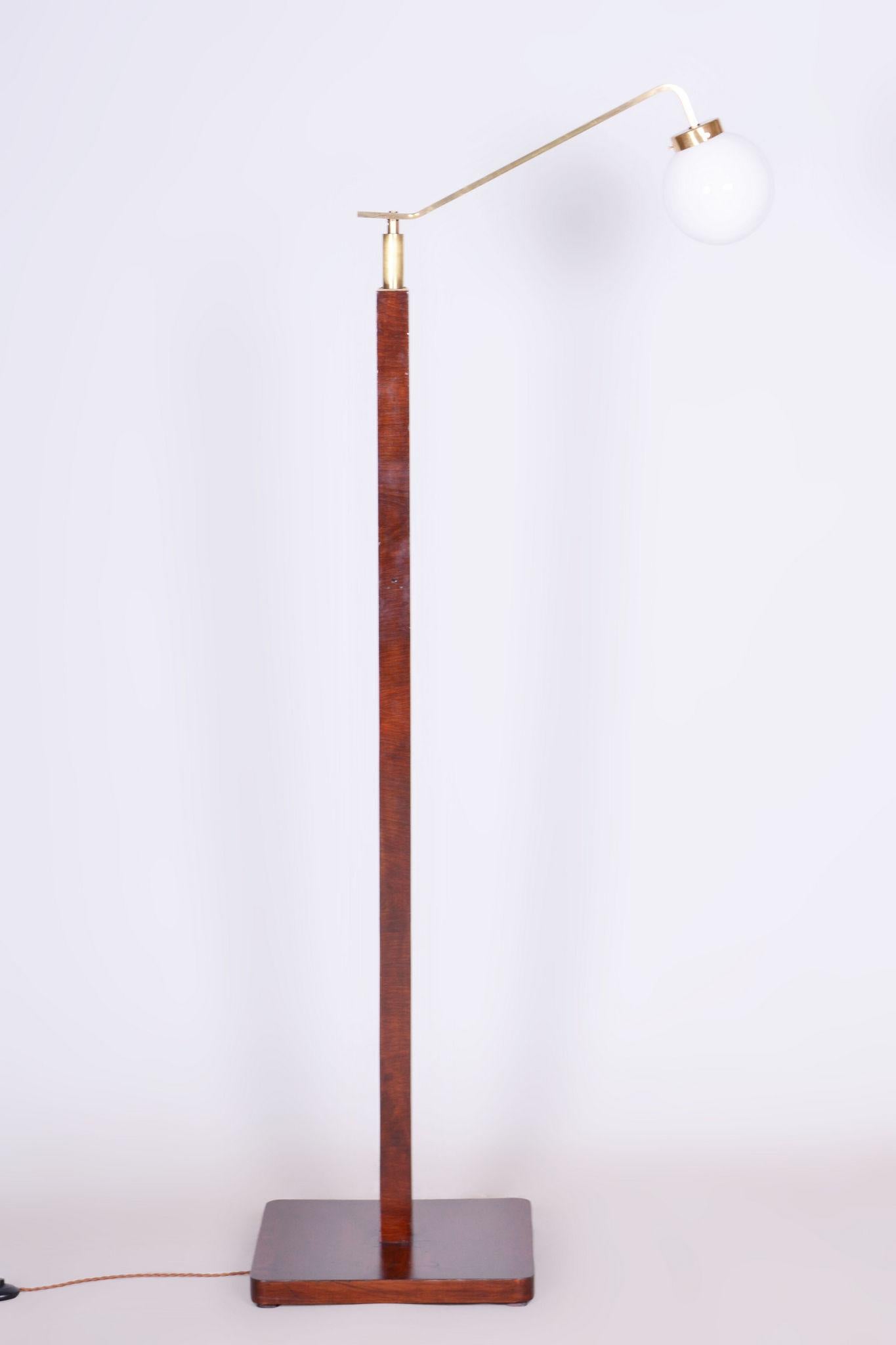 Restored Art Deco floor lamp 

Origin: Czech
Period: 1930-1939
Material: Walnut, Brass, Milk glass, Polish

It has been re-polished with polyutherane piano lacquer by our professional refurbishing team in Czechia according to the original