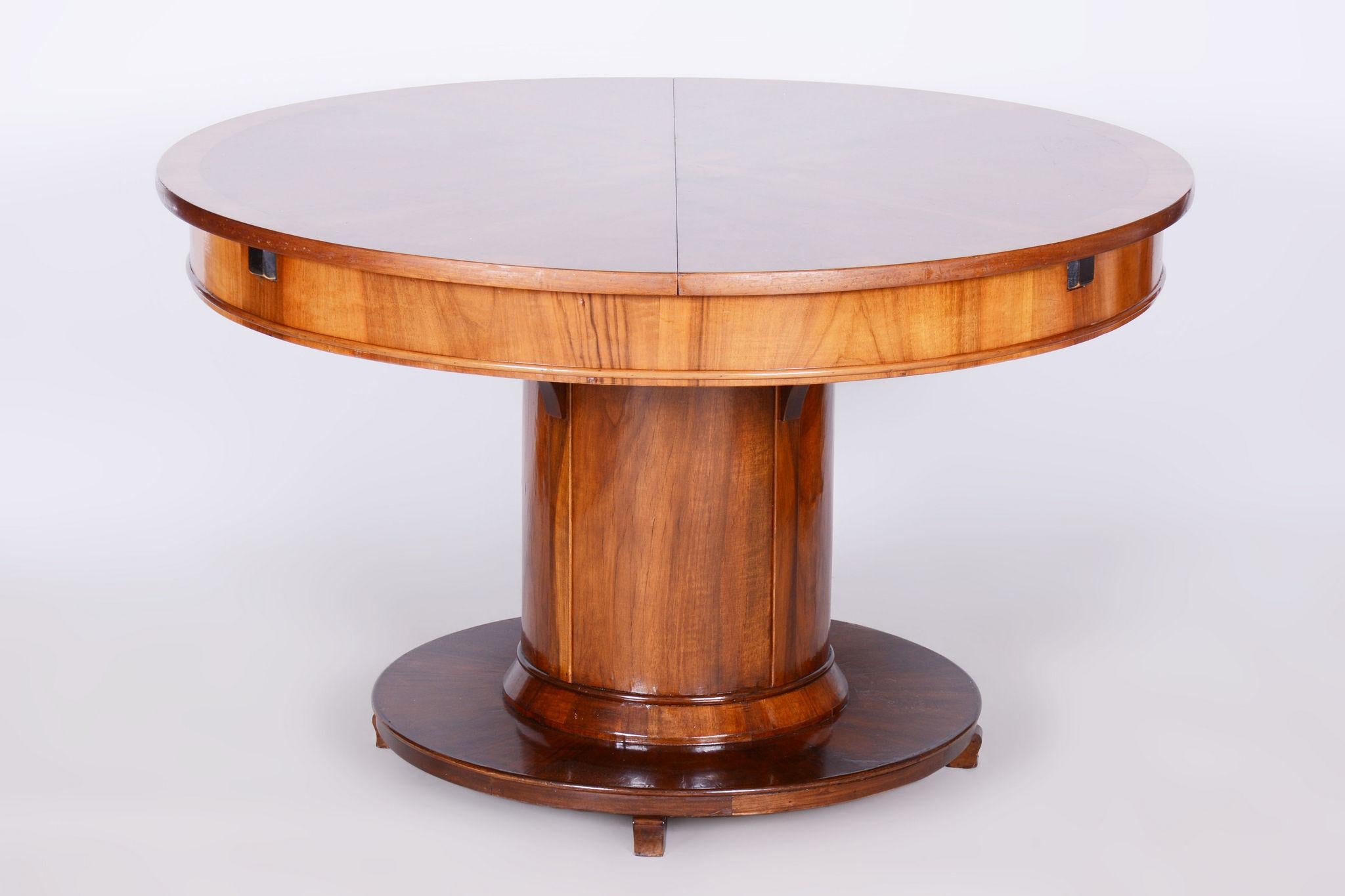 Extendable folding dining table
Period: 1920-1929
Material: Walnut,Spruce Veneer
Dissociative: 193 cm

It has been re-polished with polyutherane piano lacquer by our professional refurbishing team in Czechia according to the original