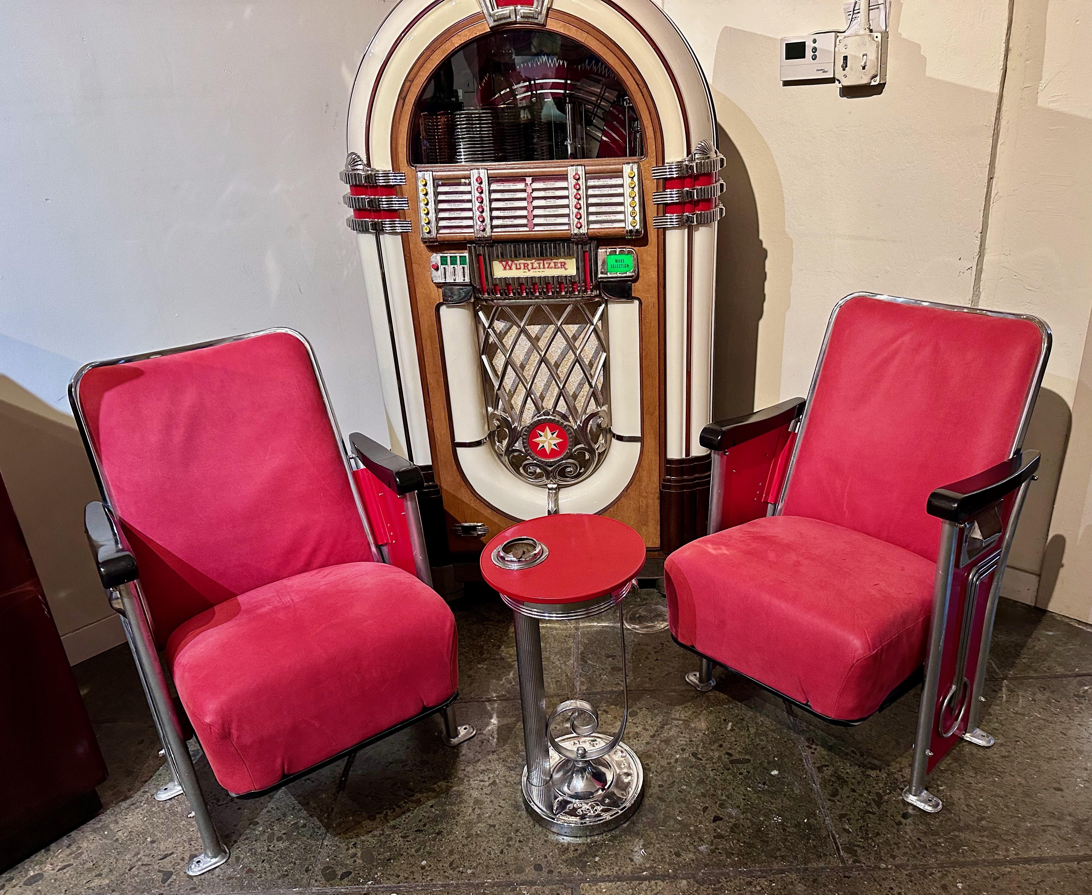 Restored Art Deco Movie Theater seats. These could showcase your home theater or just work as a pair of side chairs. Restored with nice materials, using a pebble leatherette material, nice chrome art deco details, black wood armrests, and a black
