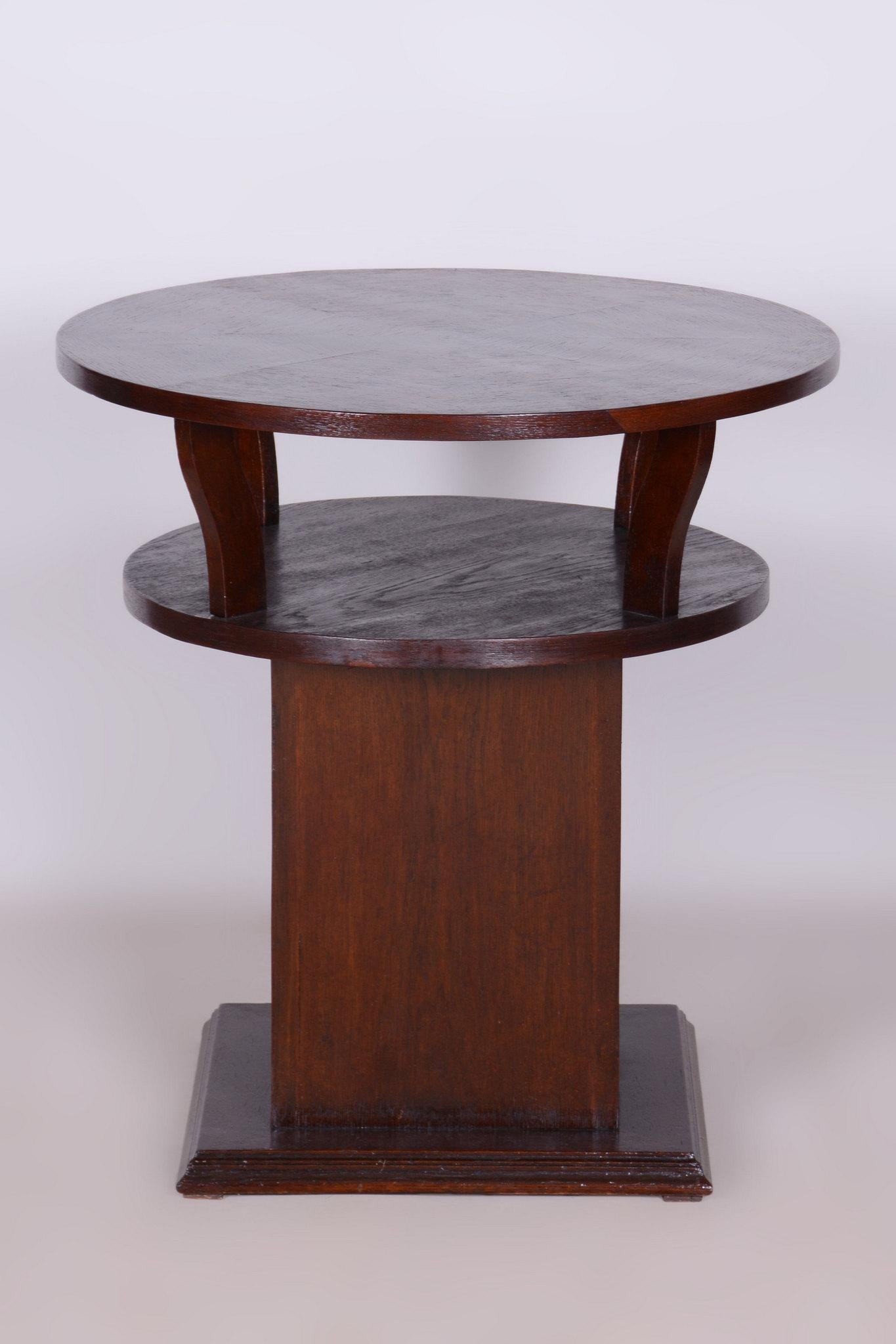 This table in Art Deco style with late Cubist elements originates from Czechoslovakia. It can also be used as a pedestal. Made from solid oak and oak veneer, it has been completely restored.

The original polish has been revived, highlighting the