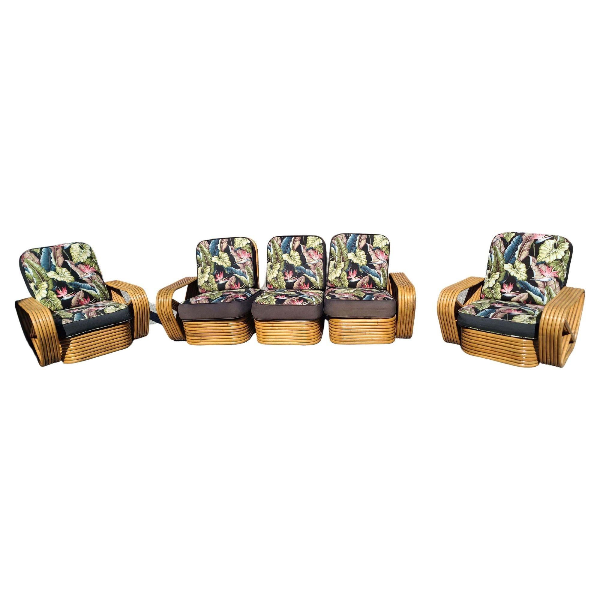 This beautifully restored Art Deco Rattan living room set includes a matching sectional sofa and two lounge chairs. A three features the famous six-strand square pretzel side arms and stacked rattan base originally designed by Paul Frankl. All were
