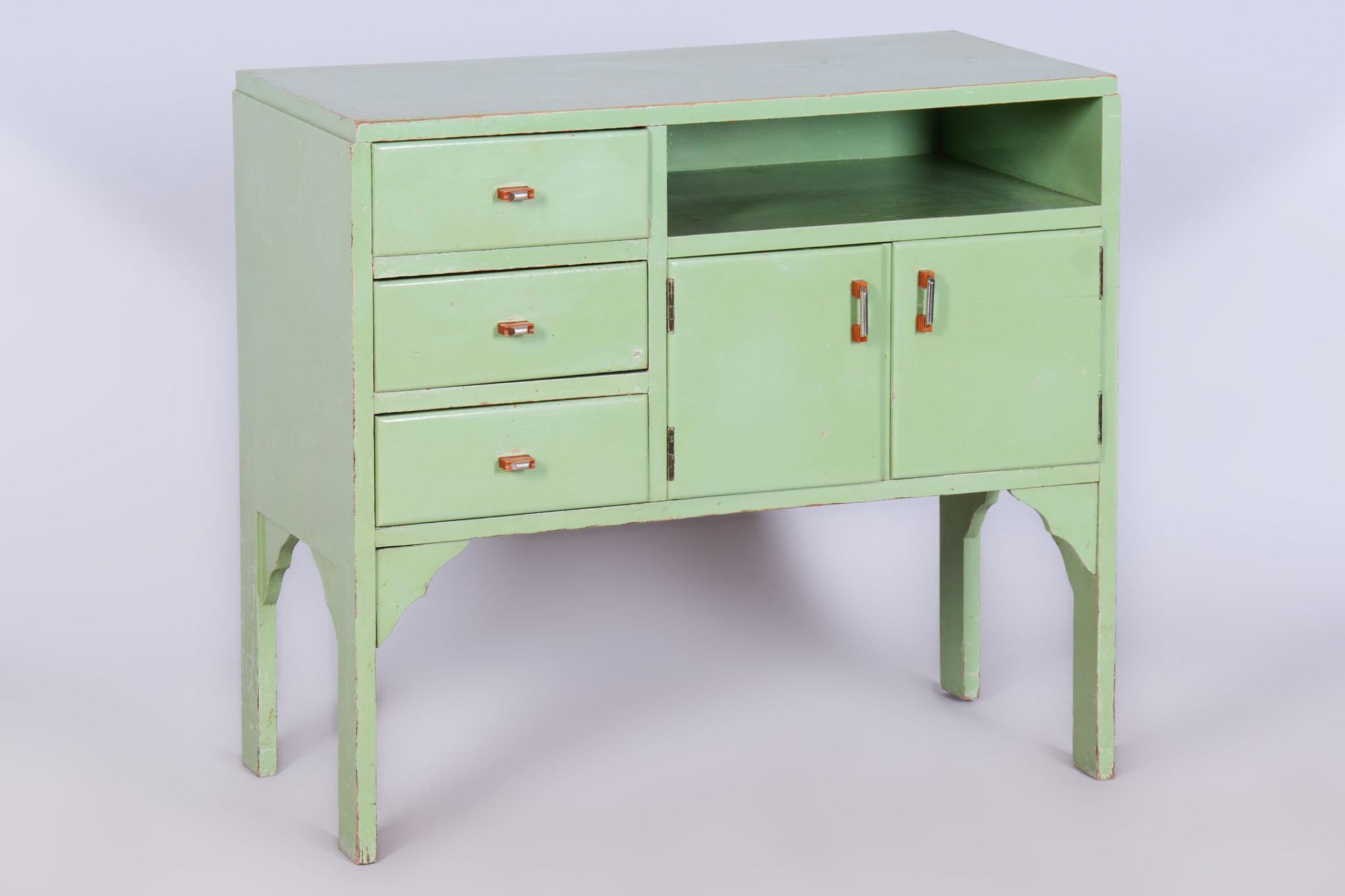 This elegant Art Deco cabinet comes from Czechoslovakia from the first half of the 20th century. It is made of lacquered spruce wood.

The cabinet has undergone careful restoration, during which its original shine and elegance were restored thanks