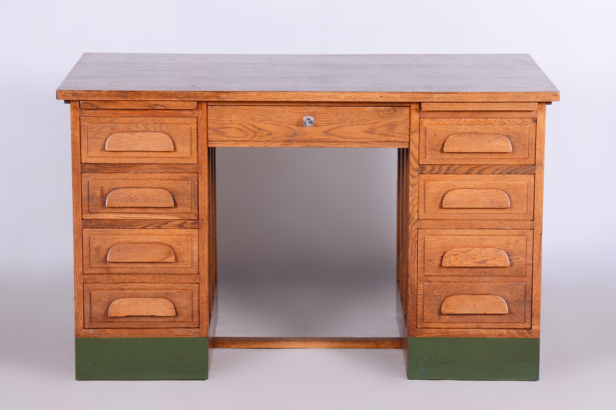 Restored Art Deco writing desk.

Revived polish.

Period: 1930-1939
Source: Czechia
Material: solid oak 

Leg space:
height: 63,5 cm (25 in)
width: 53 cm (20.9 in).
