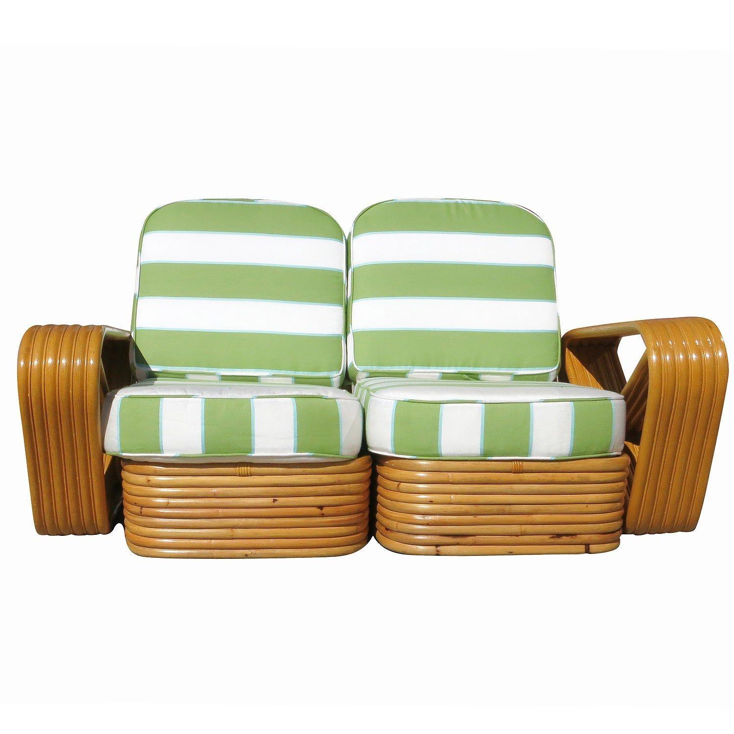 This beautifully restored Paul Frankl-style rattan blends style and vintage charm with modern comfort. It is a restored 1930s six-strand square pretzel arm rattan sectional settee with a stacked rattan base, meticulously refinished to highlight the
