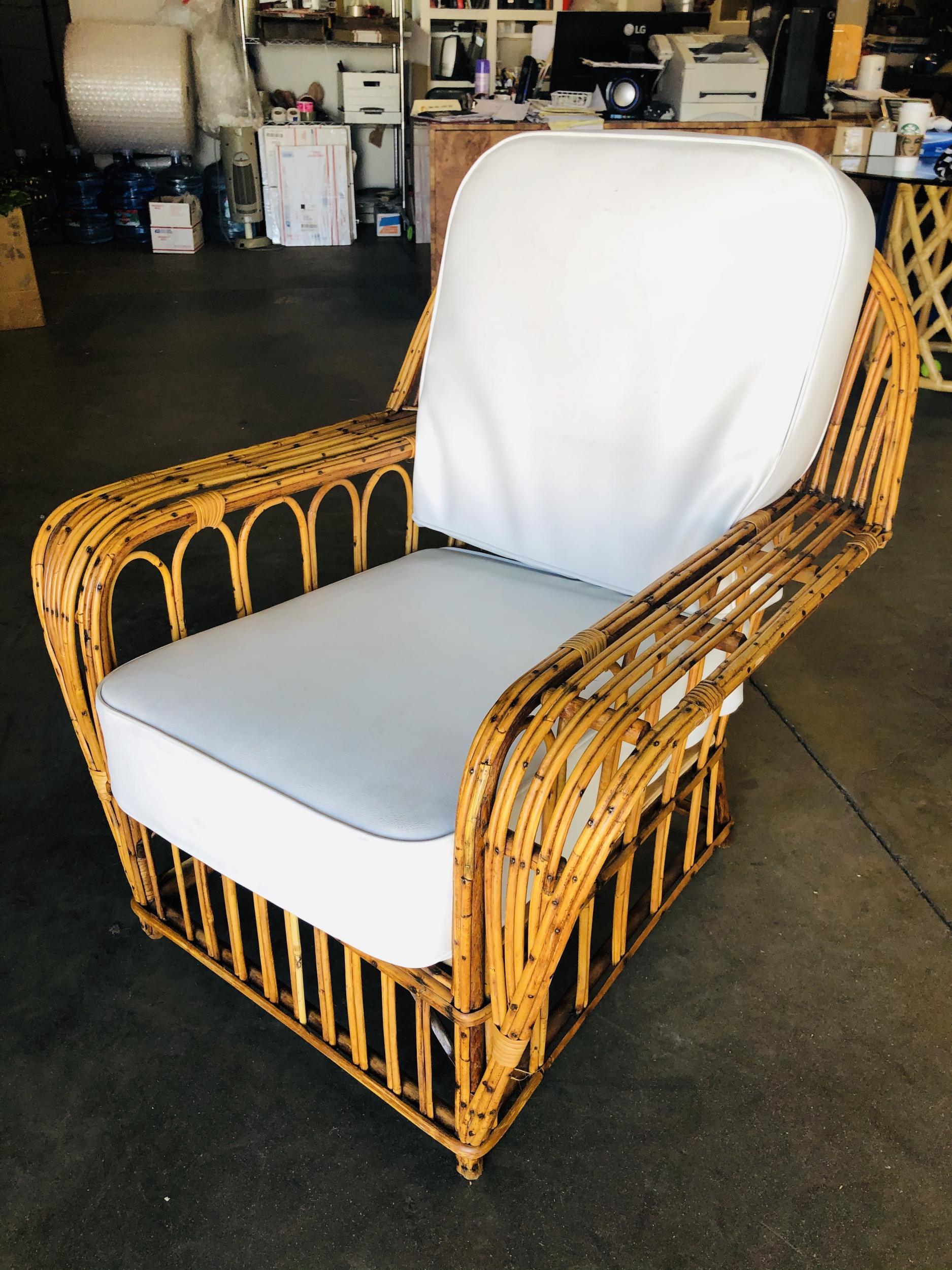 This Art Deco era rattan lounge chair with multi-strand stick rattan arms forming a Gothic cathedral style arches along the side with a seat back that fans out to a cobra shape.

Custom cushions are included in the price. Simply supply the fabric