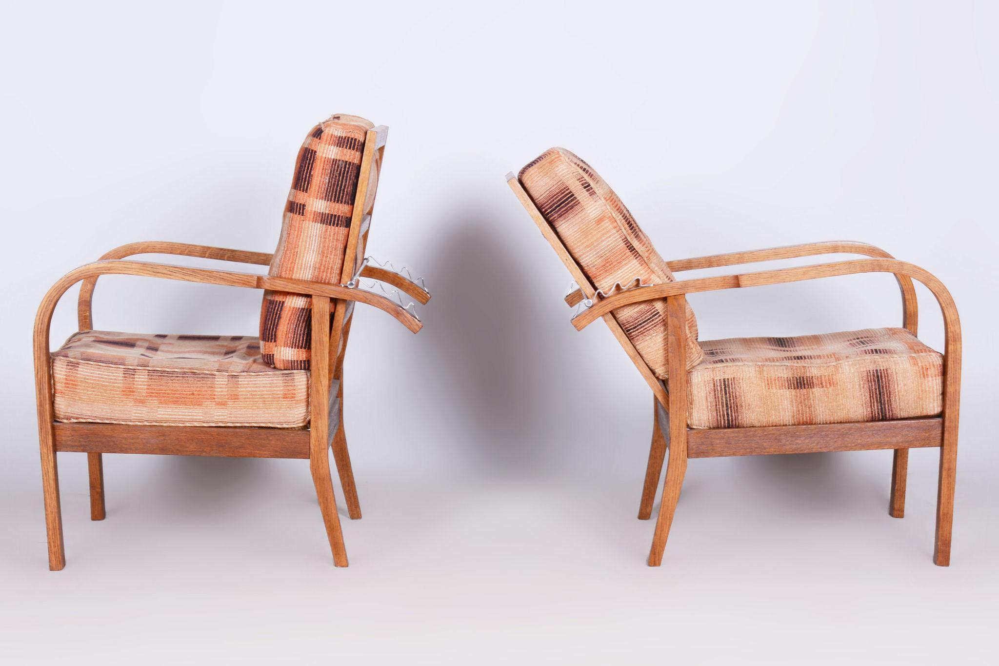 Restored ArtDeco Pair of Reclining Chairs Designed by Jindrich Halabala.

Designer: Jindřich Halabala
Maker: UP Závody
Source: Czechia 
Period: 1930-1939
Material: Oak

Revived polish.
Original upholstery in very good condition.

Designed by