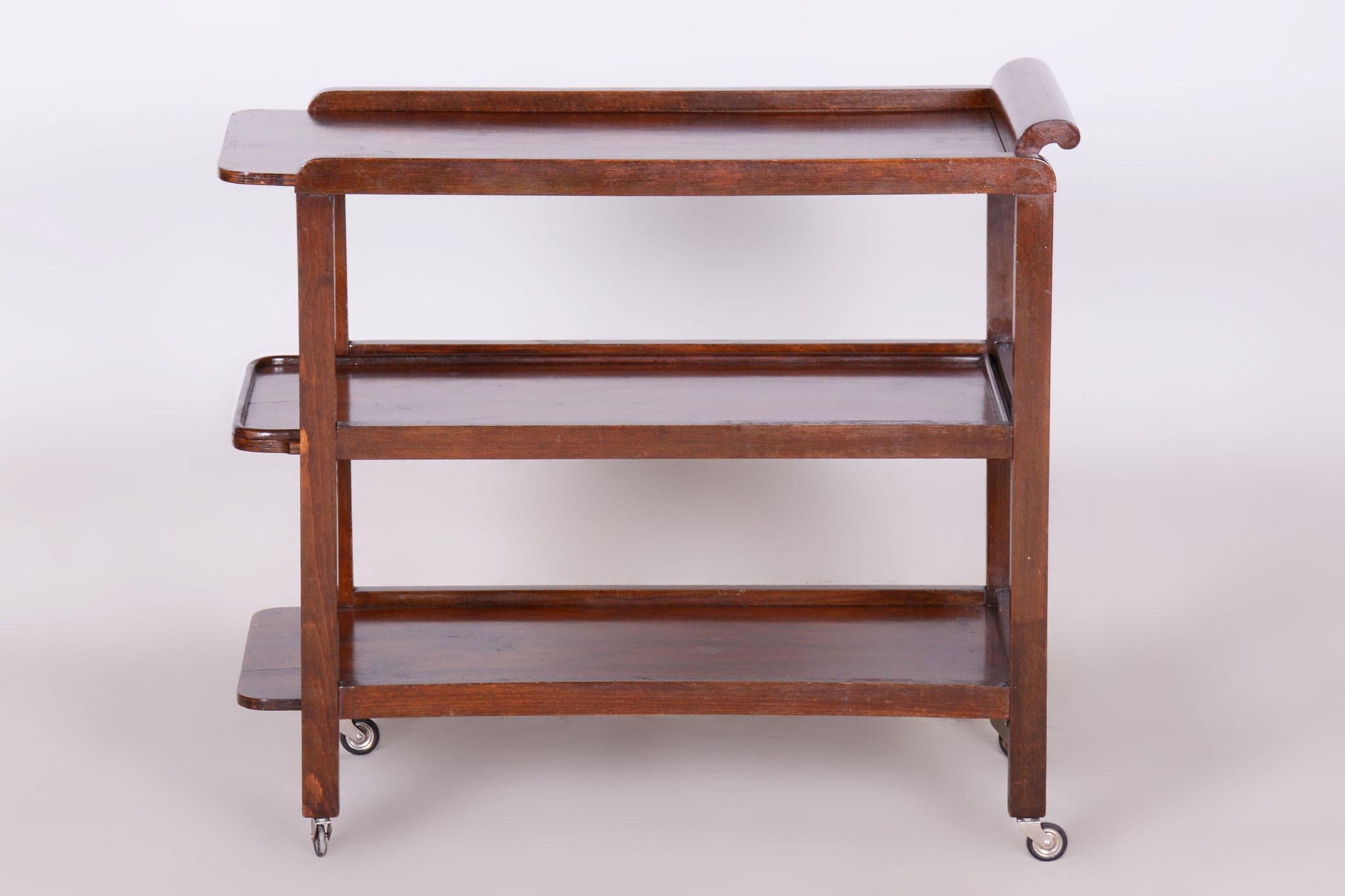 Restored Art Deco Trolley

Source: Czech
Period: 1930-1939
Material: Walnut, oak

Made by influential Austrian furniture manufacturer Thonet.			

The plates are removable and serve for serving.

Our professional refurbishing team in Czechia has