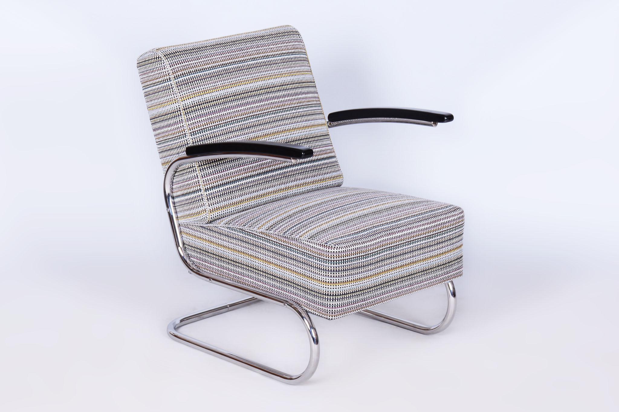Made by Mücke Melder, an influential modernist furniture manufacturer specializing in tubular steel designs. 

It has been reupholstered by our professional refurbishing team in Czechia. Please contact us to find out the details of its