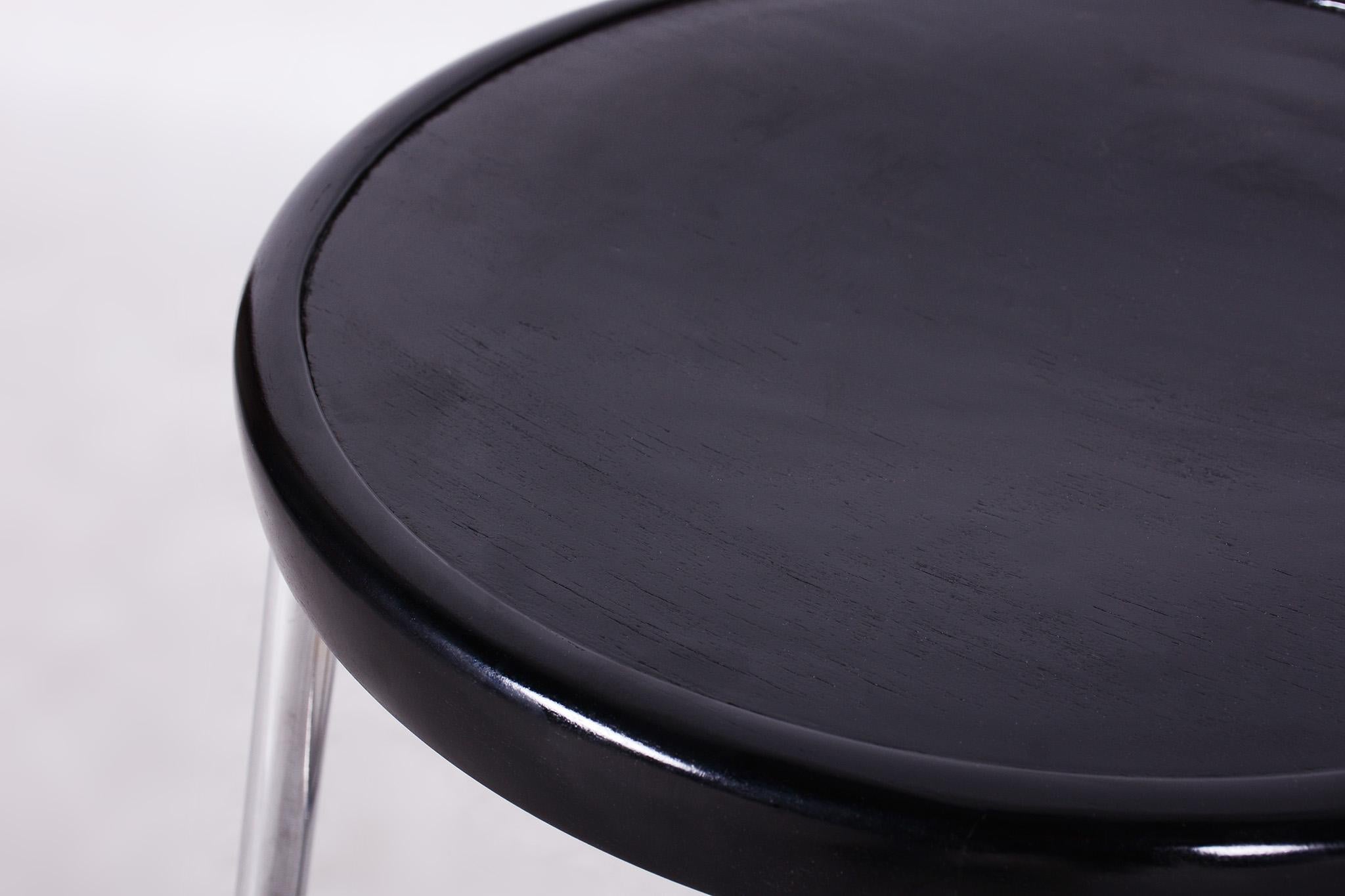 Restored Bauhaus black stool.

Source: Czechia (Czehoslovakia)
Period: 1930-1939
Material: Beech, Chrome-Plated Steel

Our professional refurbishing team in Czechia has fully restored it according to the original process. The chrome parts have