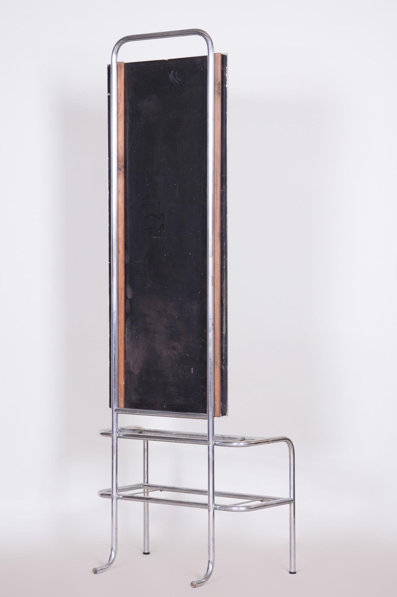 Restored Bauhaus dressing mirror.

Period: 1930-1939
Source: Czechia
Material: chrome-plated steel, mirror, glass
New glass shelves and mirror.

The chrome parts have been cleaned and professionally restored. 

It has been fully restored by