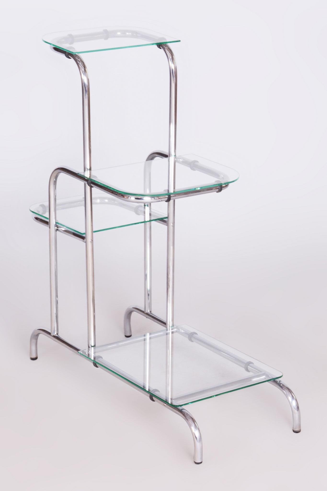 Restored Bauhaus Etagere.

Source: Czechia (Czechoslovakia)
Period: 1930-1939
Material: Chrome-Plated Steel, Glass

The chrome parts have been professionally cleaned. 

This item features classic Bauhaus design elements. Elements of this style are