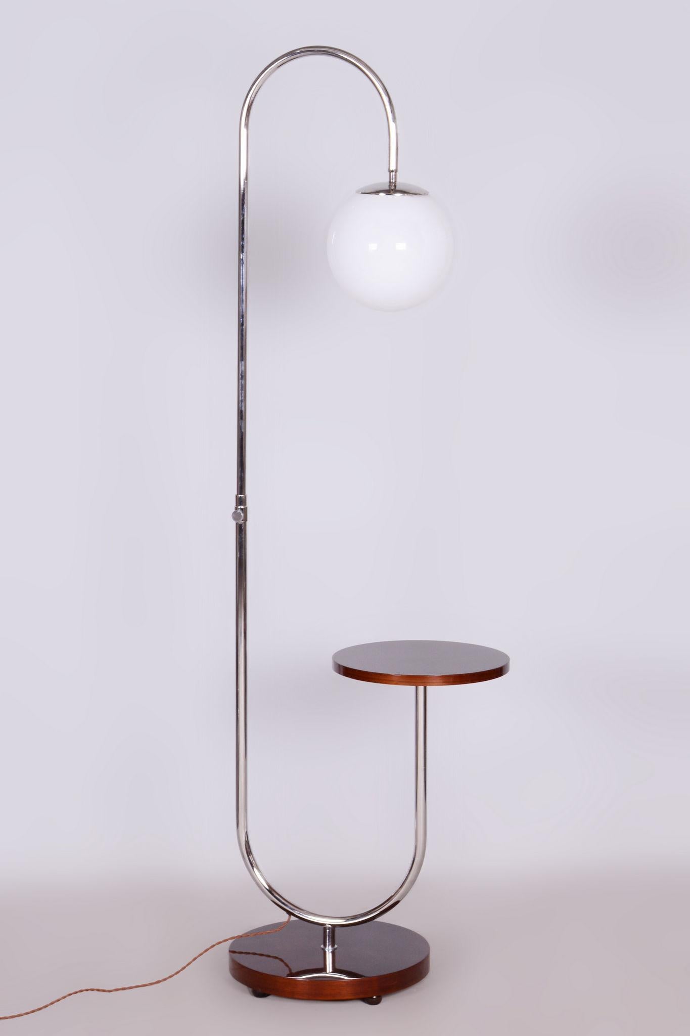 Restored Bauhaus Floor Lamp with High Gloss.

Material: Walnut, Chrome-plated Steel, Milk Glass
Source: Czechia (Czechoslovakia)
Period: 1930-1939

The wood is veneered with walnut root veneer.
Luxurious finish to a high gloss.
The diameter of the