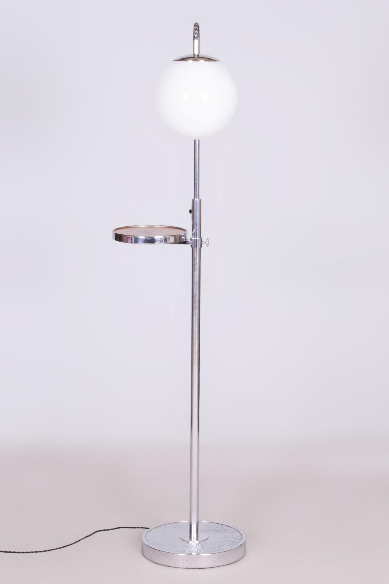 Restored Bauhaus Floor Lamp Made by Hynek Gottwald.

Material: Chrome-plated Steel, Milk Glass
Maker: Hynek Gottwald
Source: Czechia 
New electrification.
The diameter of the ball is 25cm.

The chrome parts have been cleaned and professionally
