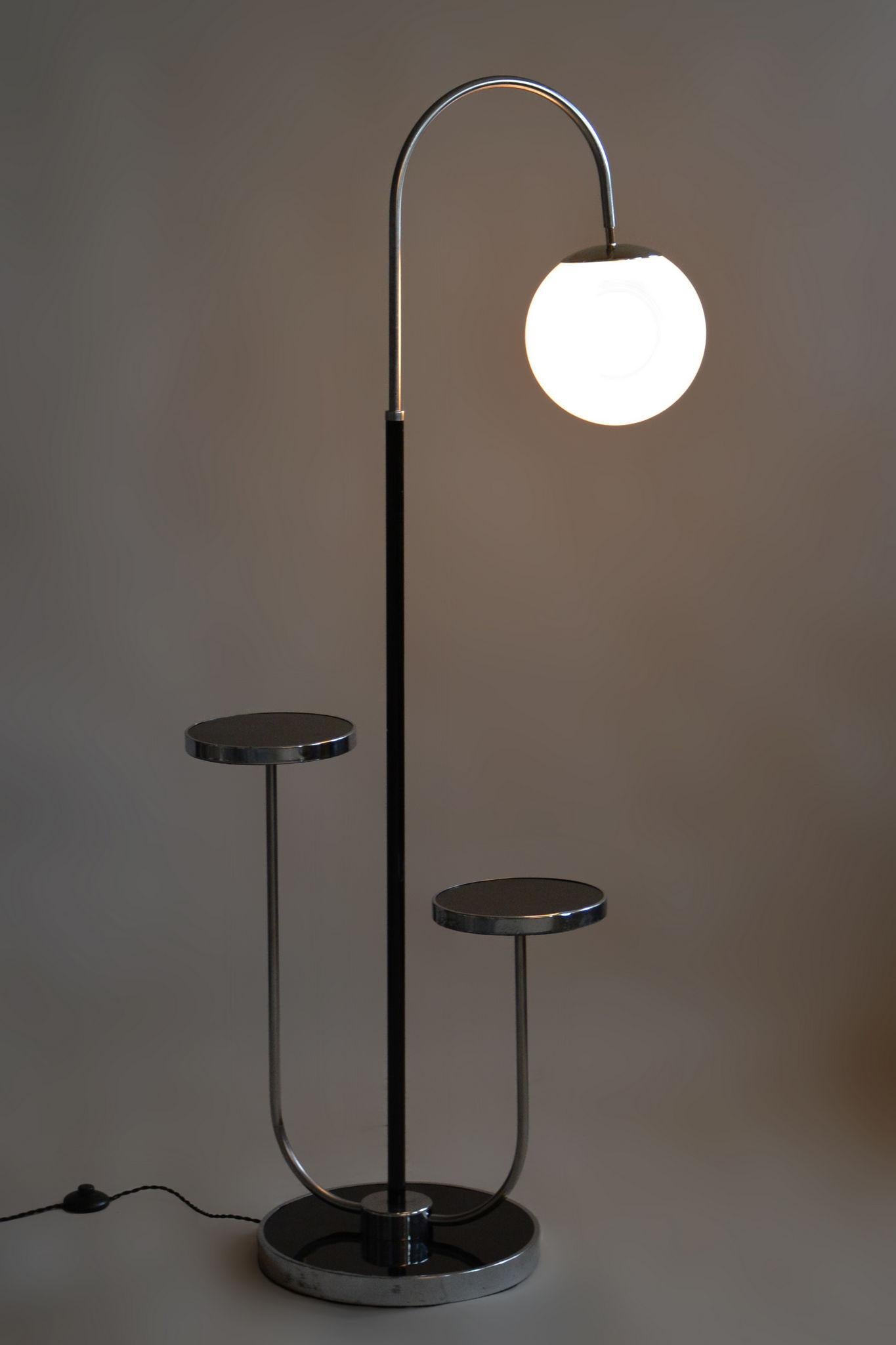 Restored Bauhaus Floor Lamp Designed By Jindrich Halabala.

Designer: Jindrich Halabala
Maker: UP Zavody
Material: Chrome-plated Steel, Opal Glass, Lacquered Wood
Source: Czechia 
Period: 1930-1939
The diameter of the ball is 25cm.

The chrome parts