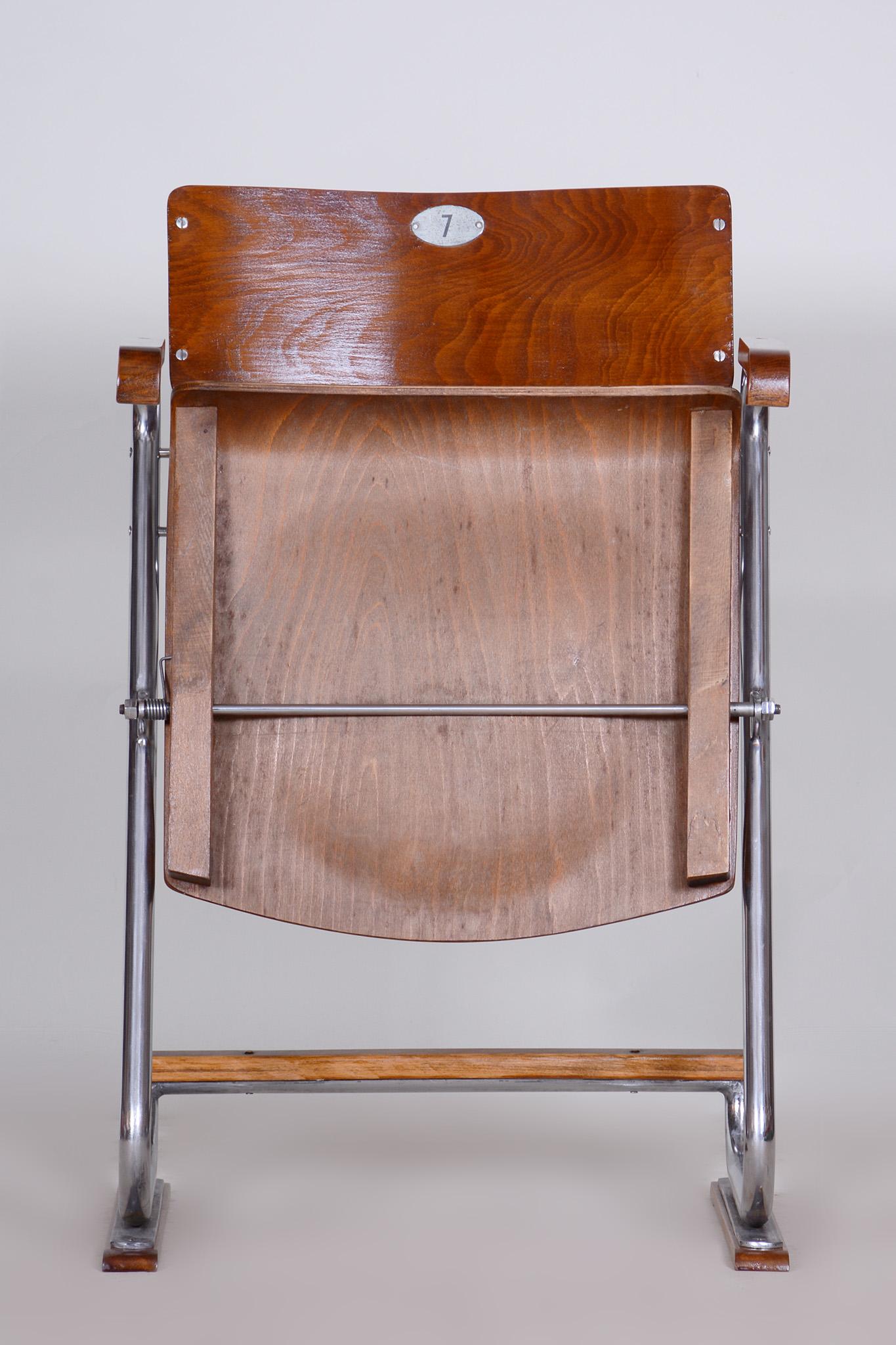 Restored Bauhaus Folding Chair.

Style: Bauhaus
Period: 1930-1939
Source: Czechia
Seat height: 48 cm / 17.72?
Material: Beech Plywood, Chrome-plated Steel.

The chrome parts have been cleaned and professionally restored. 

This item