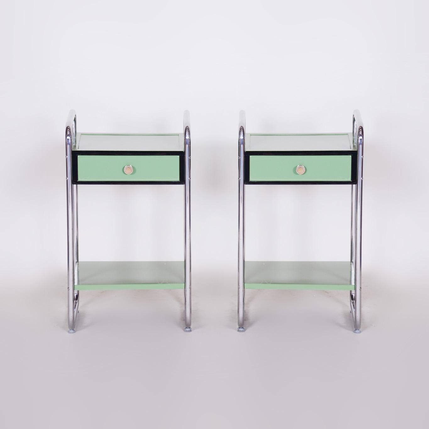 Restored Bauhaus Pair of Bed-Side Tables.

Period: 1930-39
Source: Czechia (Czechoslovakia)
Material: Chrome-Plated Steel, Lacquered Wood

It has been re-polished with polyutherane piano lacquer by our professional refurbishing team in Czechia