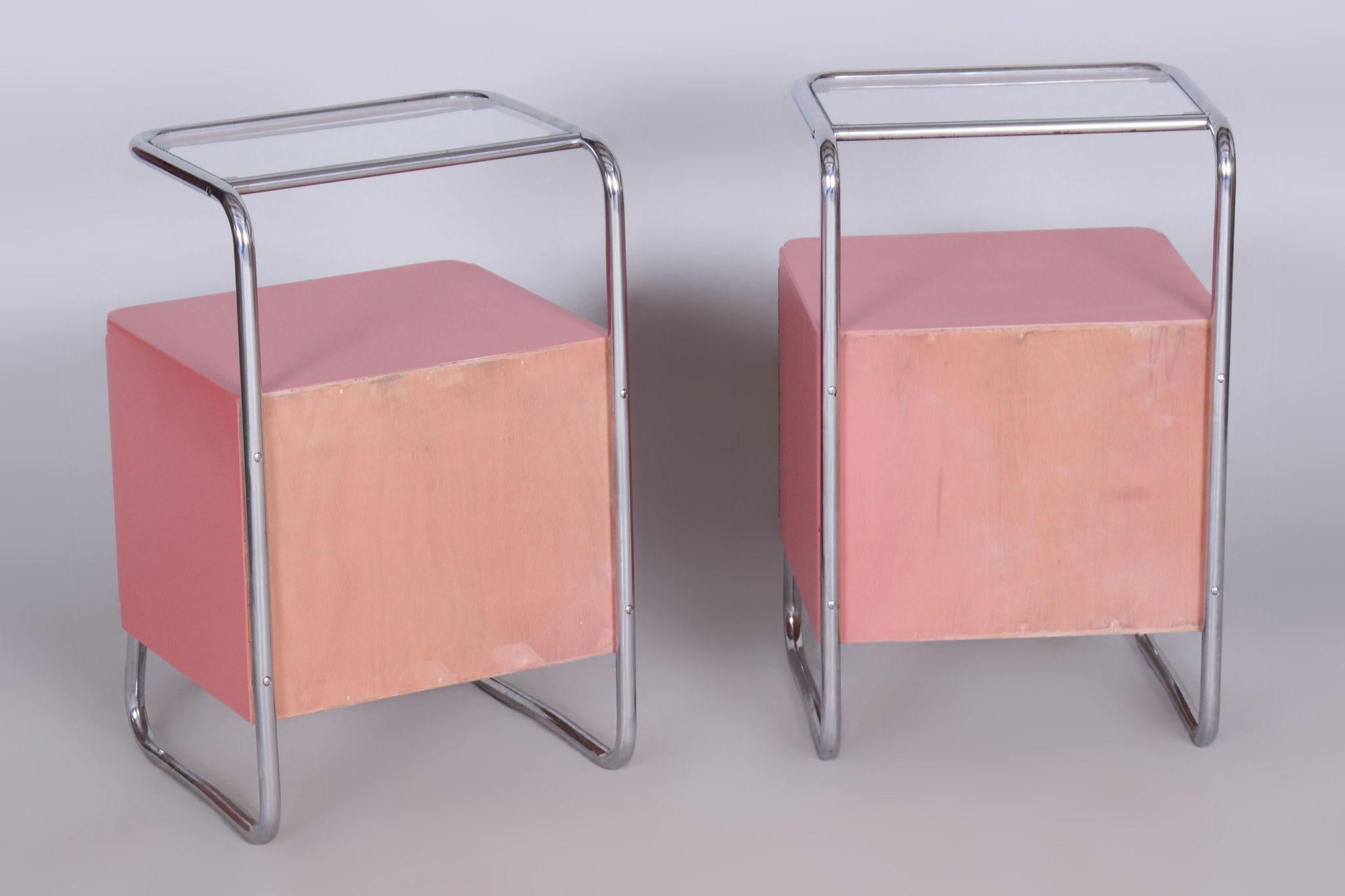 Restored Bauhaus Pair of Bed-Side Tables.

Period: 1940-1949
Source: Czechia (Czechoslovakia)
Material: Chrome-Plated Steel, Clear Glass, Lacquered Wood

New glass.
New pink lacquer was made according to the original model.

Our professional