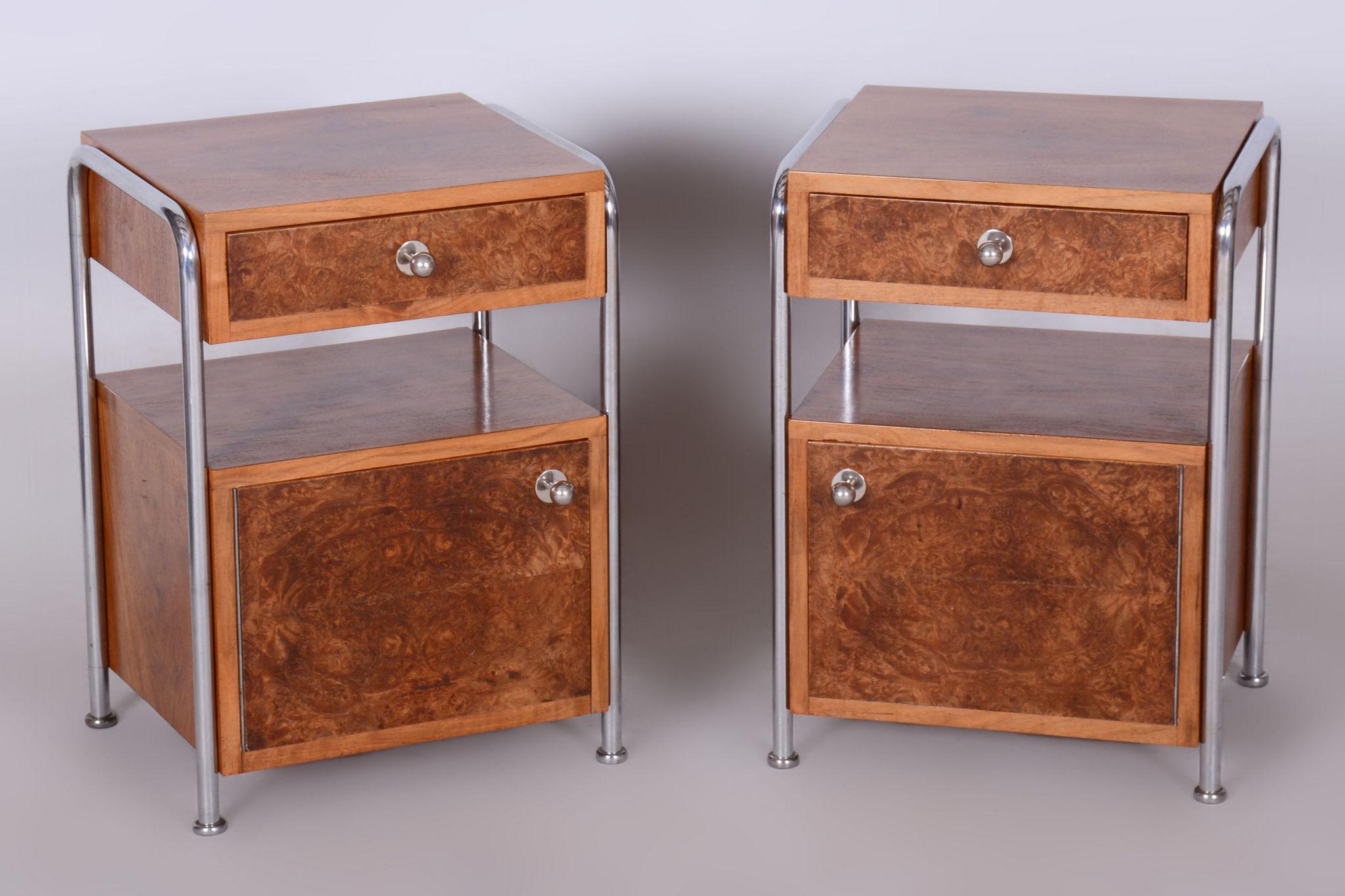 Restored Bauhaus Pair of Bed-Side Tables, Hynek Gottwald.

Period: 1930-1939
Maker: Hynek Gottwald
Source: Czechia (Czechoslovakia)
Material: Chrome-plated steel, lacquered walnut root veneer

Made by Hynek Gottwald, a company credited with being