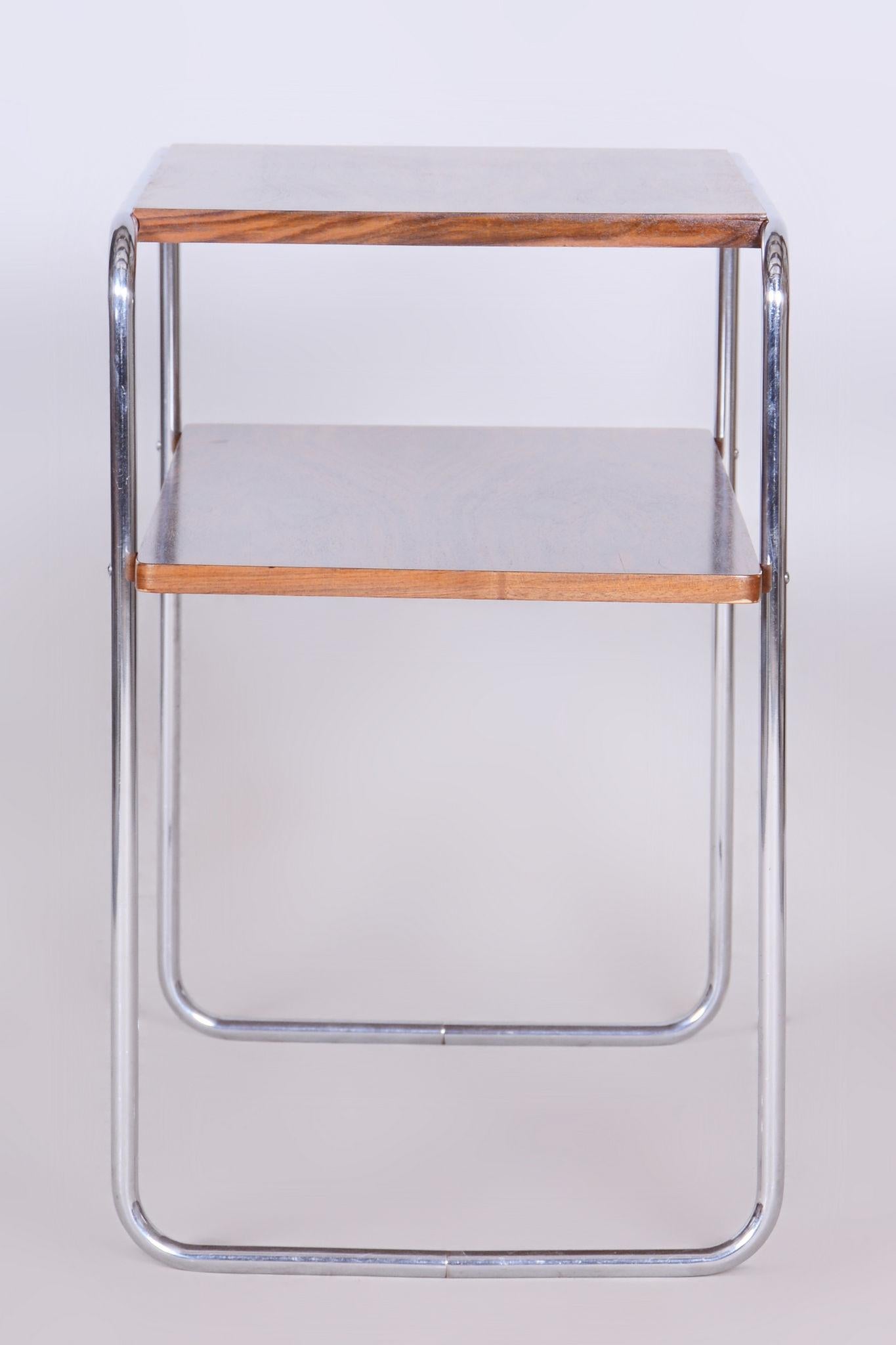 Restored Bauhaus Side Table Made by Hynek Gottwald.

Maker: Hynek Gottwald
Source: Czechia (Czehoslovakia)
Period: 1930-1939
Material: Chrome-plated Steel, Walnut

Revitalized polish.
The chrome parts have been professionally cleaned.	
	
Made by