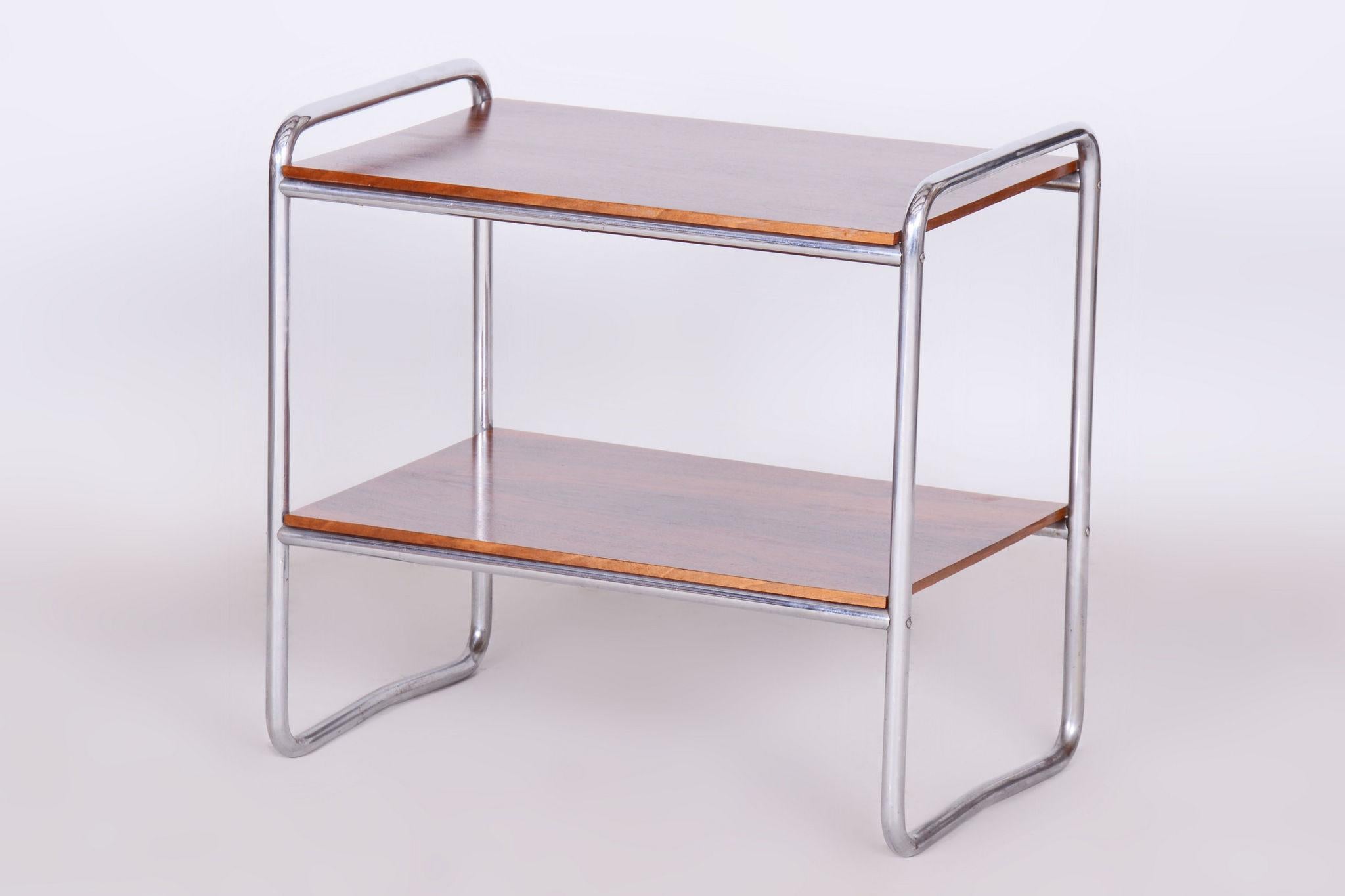 Restored Bauhaus Side Table.

Source: Czechia 
Period: 1930-1939
Material: Walnut, Chrome-Plated Steel

Our professional refurbishing team in Czechia has fully restored it according to the original process. 
The chrome parts have been cleaned and