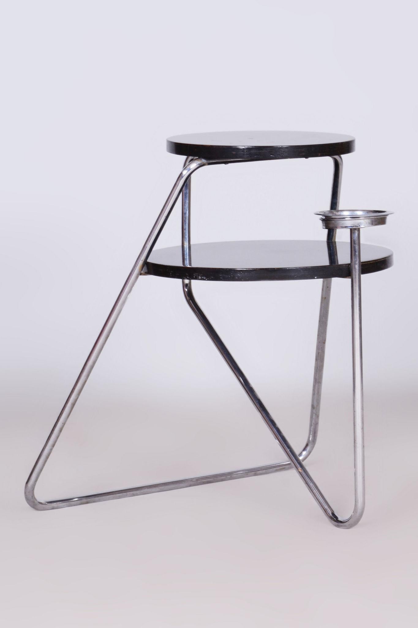 Restored Bauhaus Small Table. Revived Polish.

Material: Chrome-plated Steel, Blackened Batten
Source: Czechia 
Period: 1930-1939

For its time, this table has a very unusual avant-garde modernist design.

The chrome parts have been cleaned and