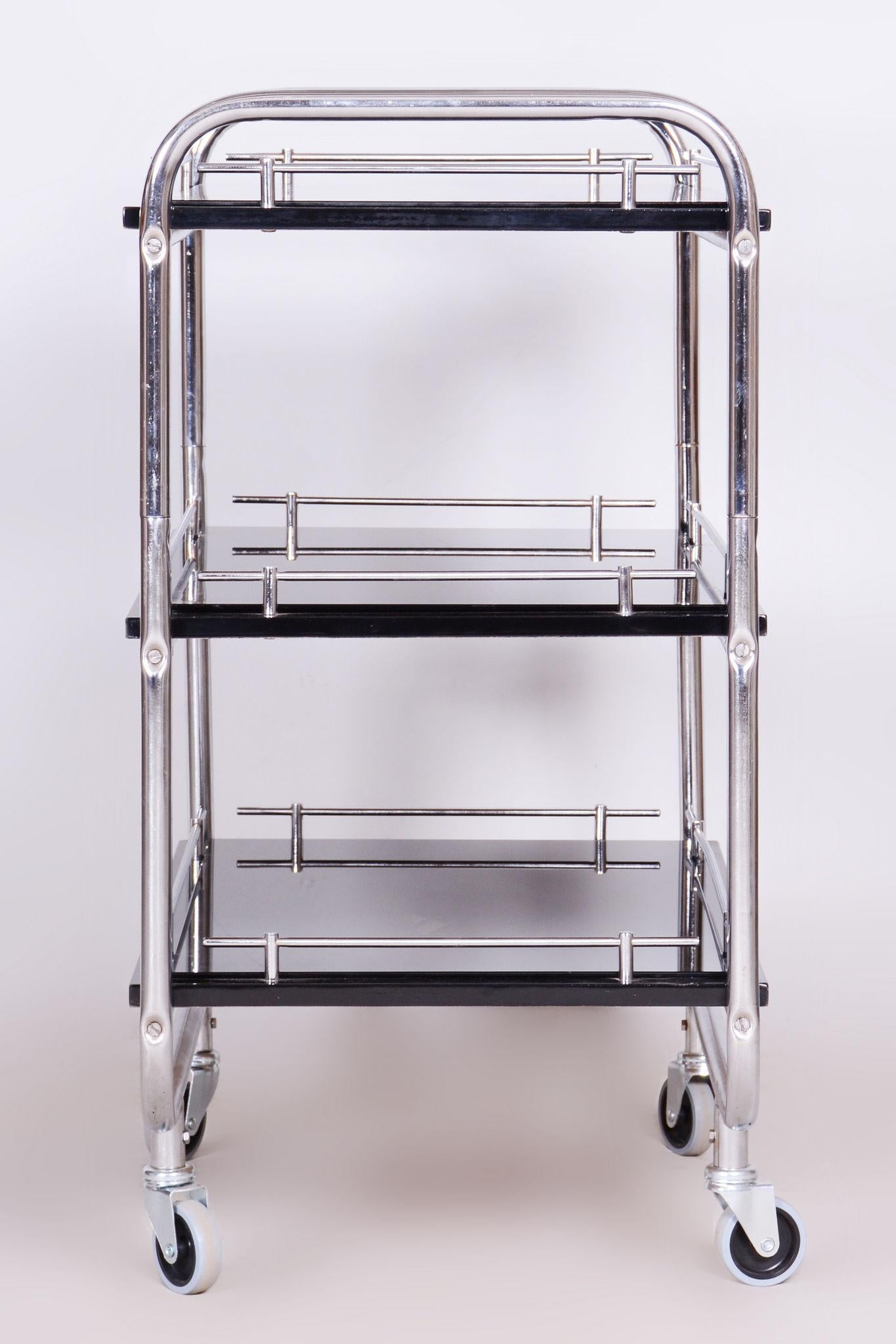 Restored Bauhaus Trolley Made By Kovona.

Maker: Kovona
Material: Chrome-plated Steel, Varnished Wood, Glass
Source: Czechia (Czechoslovakia)
Period: 1930-1939

Newly painted shelves.
The chrome parts have been cleaned and professionally restored.